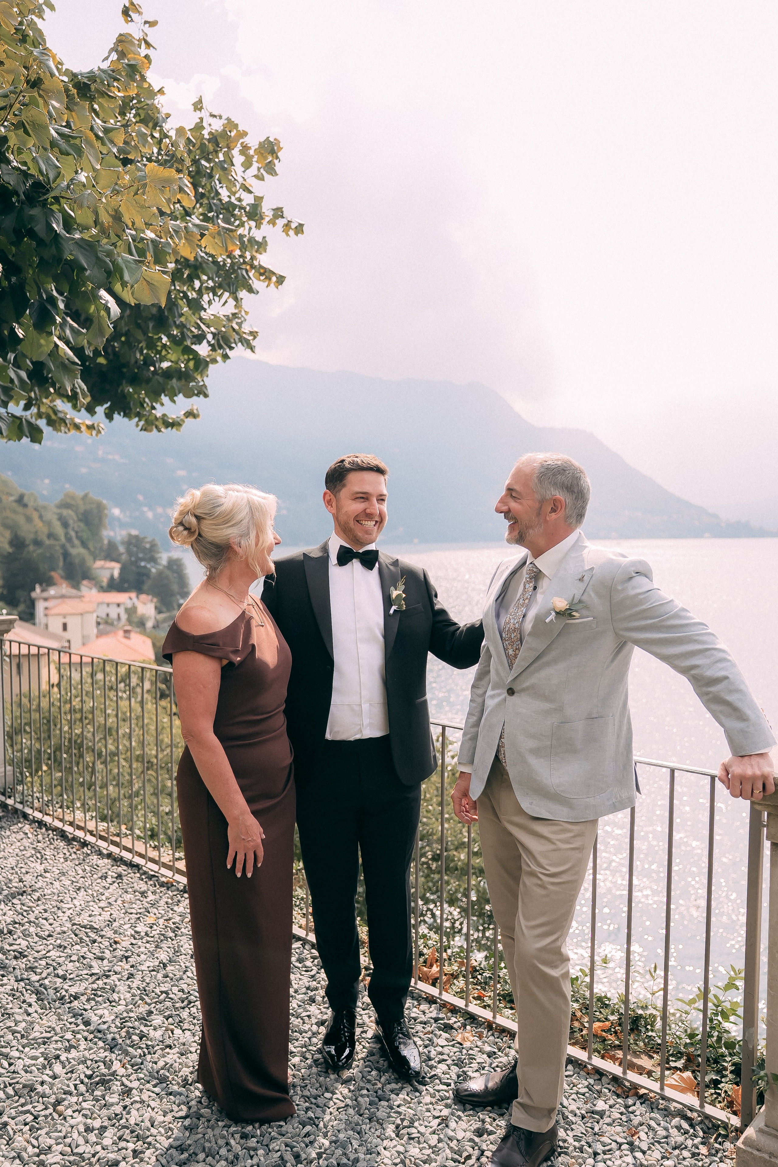 Groom embracing a guest at the Villa Lario wedding, Lake Como, Italy