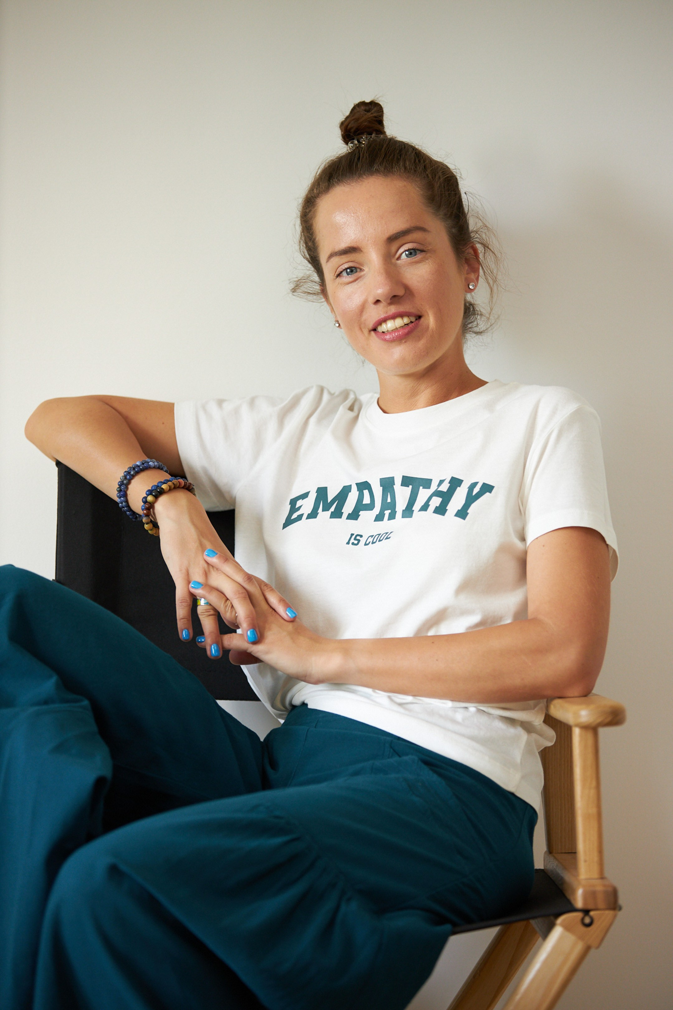 Emotional portrait of a young lady on a white studio background - - photographer Andrey Dunin