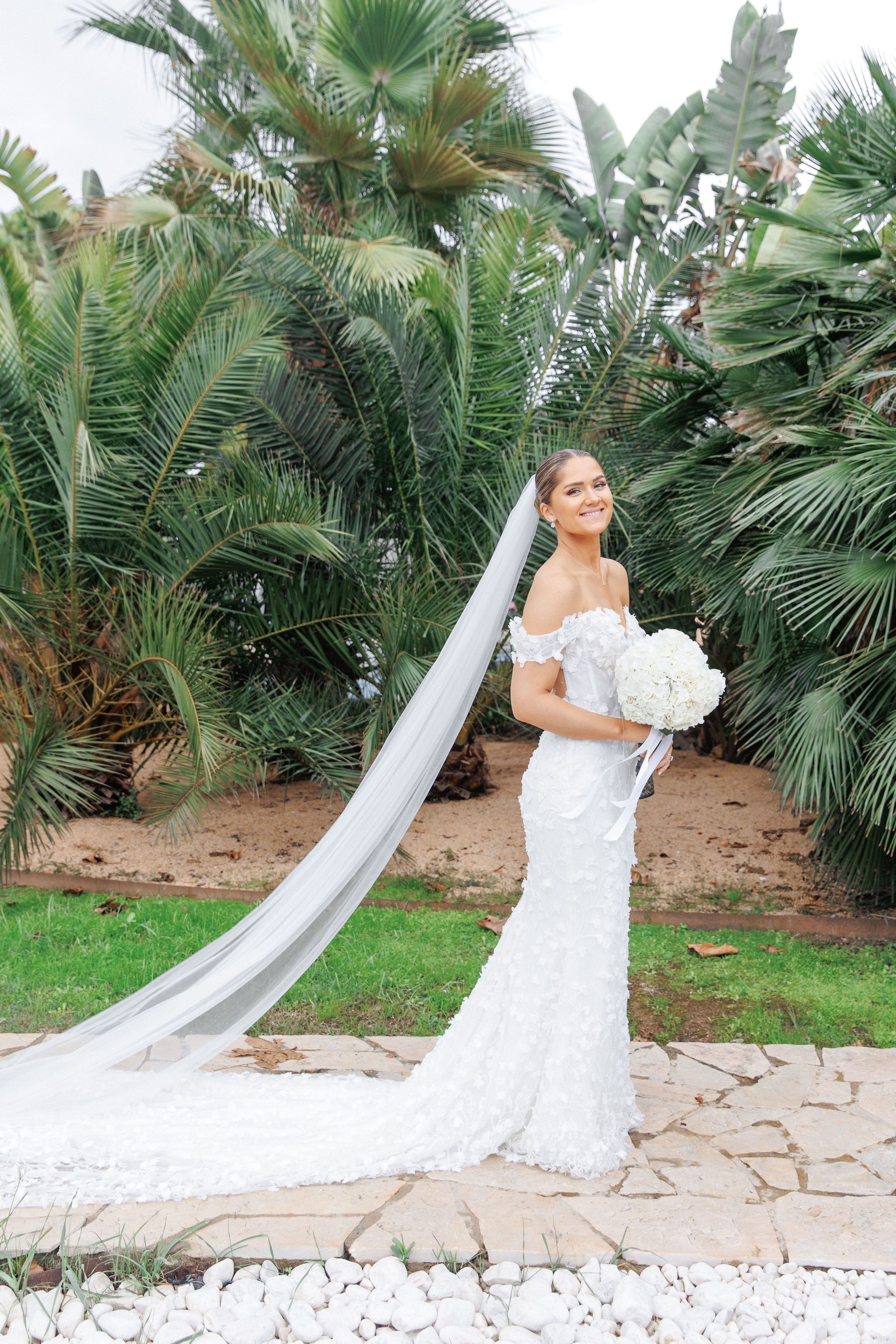 Stunning bridal portrait showcasing elegant wedding dress and garden of the Barcelona wedding venue.