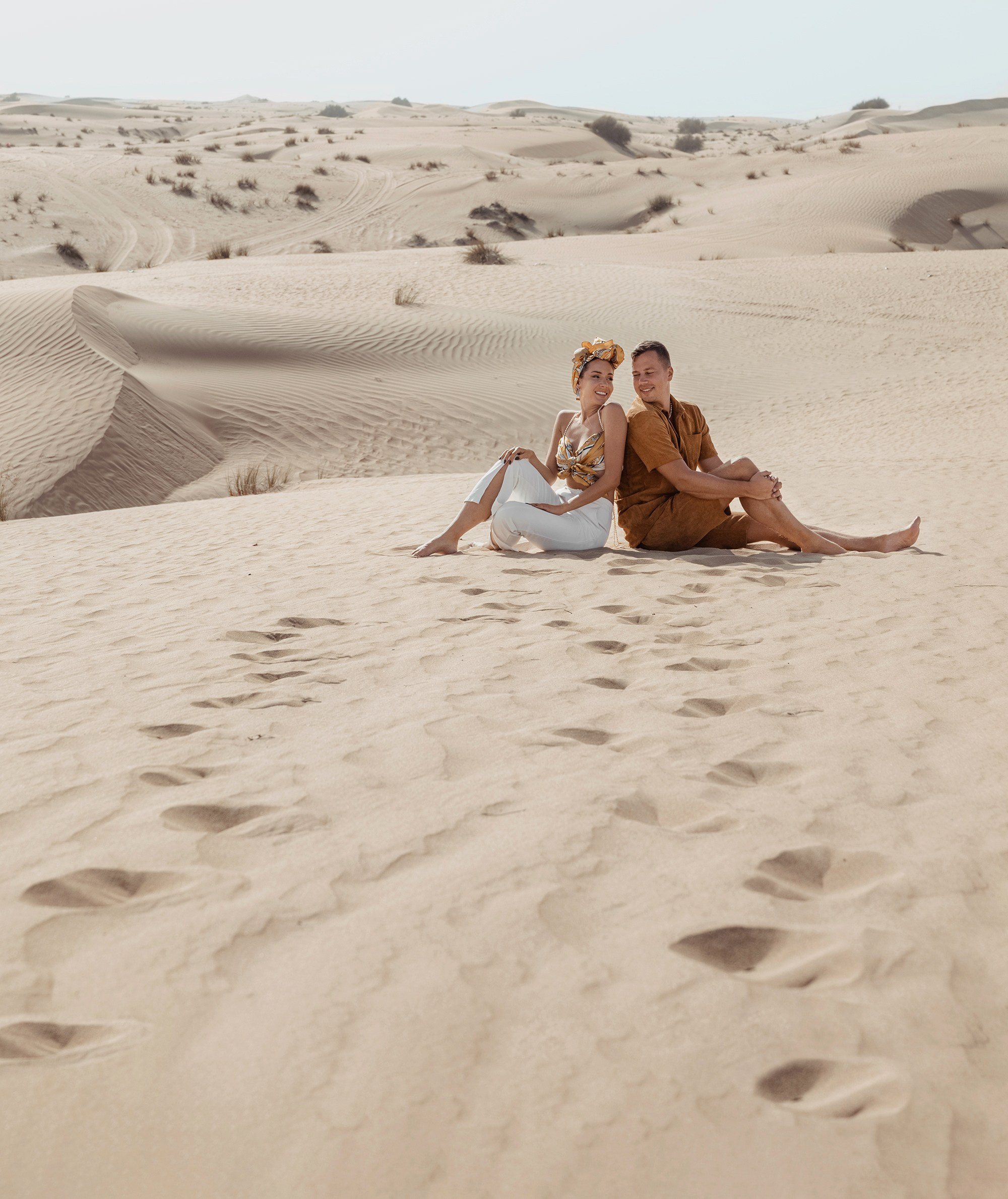 A couple’s love story unfolds in the desert, with playful moments and heartfelt embraces under the open sky. Dubai, United Arab Emirates