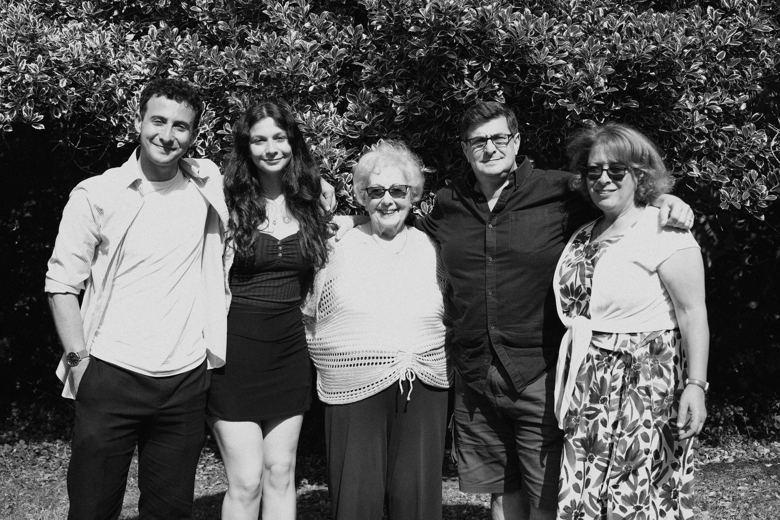 Candid outdoor portrait in Hampton-in-Arden for 90th birthday – family gathered with joy.