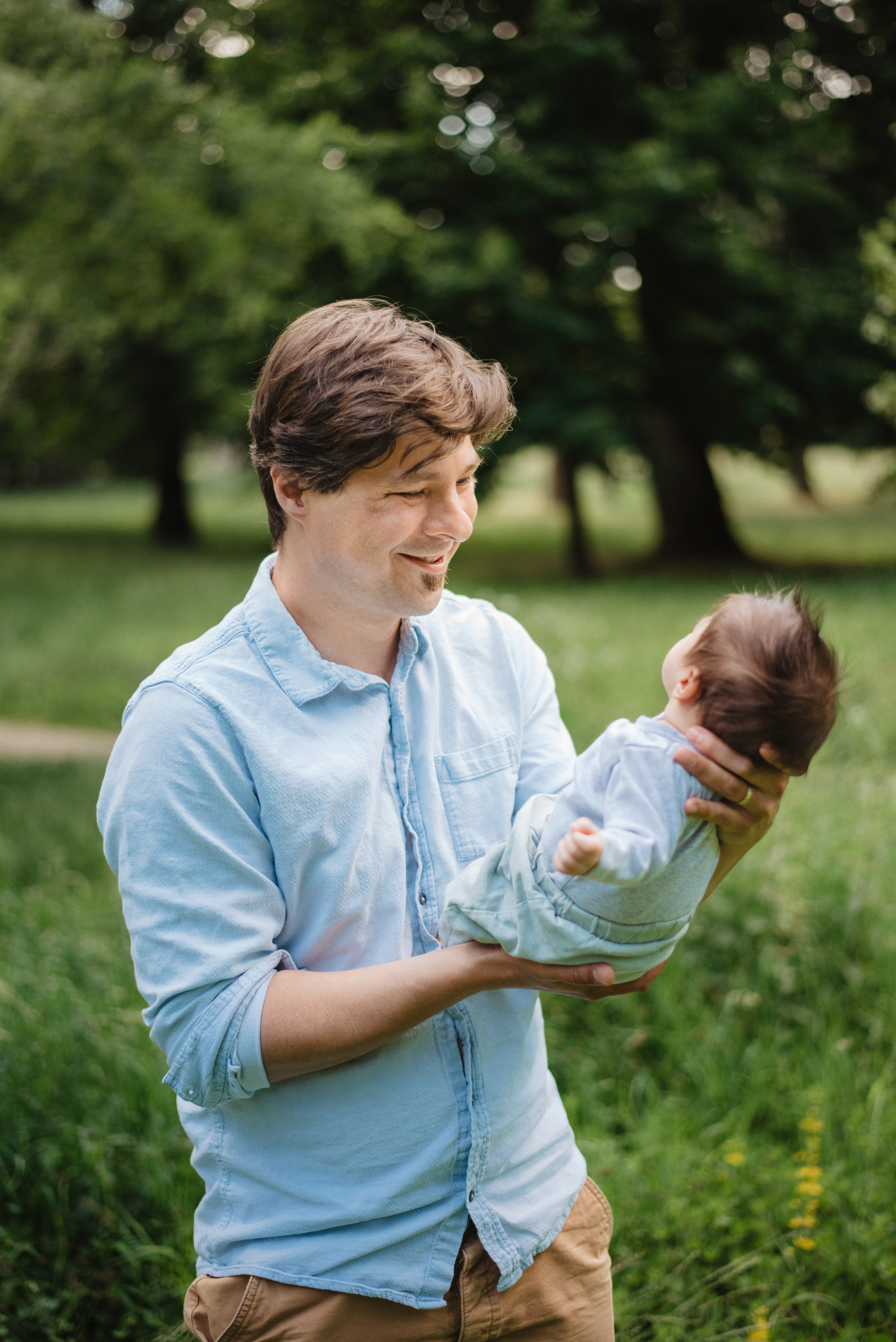 Family photography in park. Lifestyle, wedding and family photographer