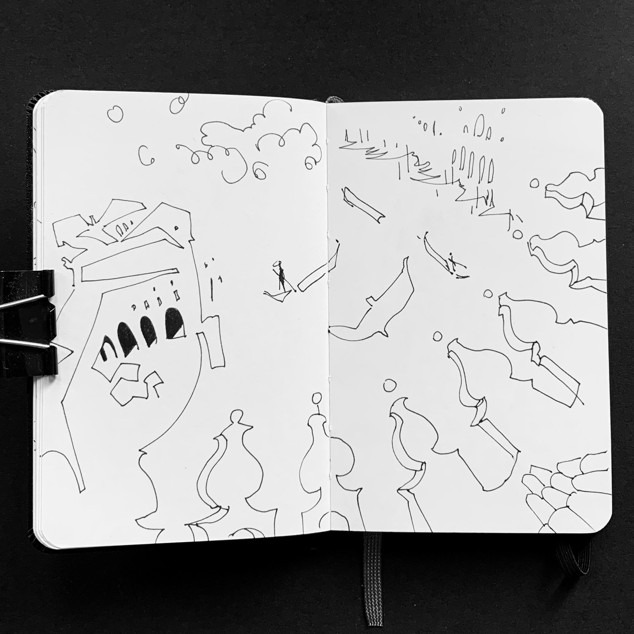 Moleskine notebook with hand-drawn sketches made in Venice, serving as an artist’s visual diary and personal testimony within a contemporary practice. Minimalist drawing from a roof.