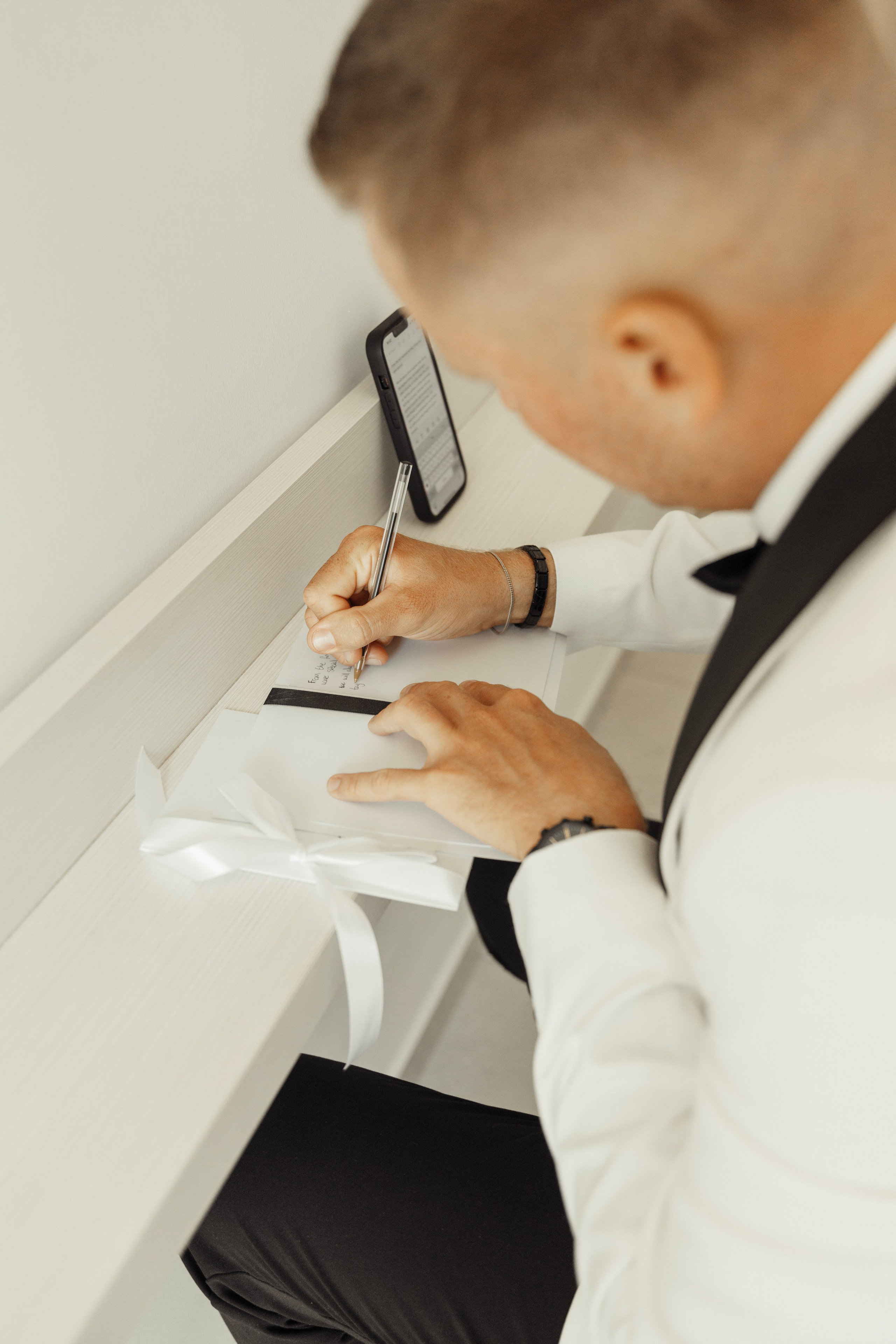 The groom writes a vow to the bride before the ceremony. Rhodes, Greece