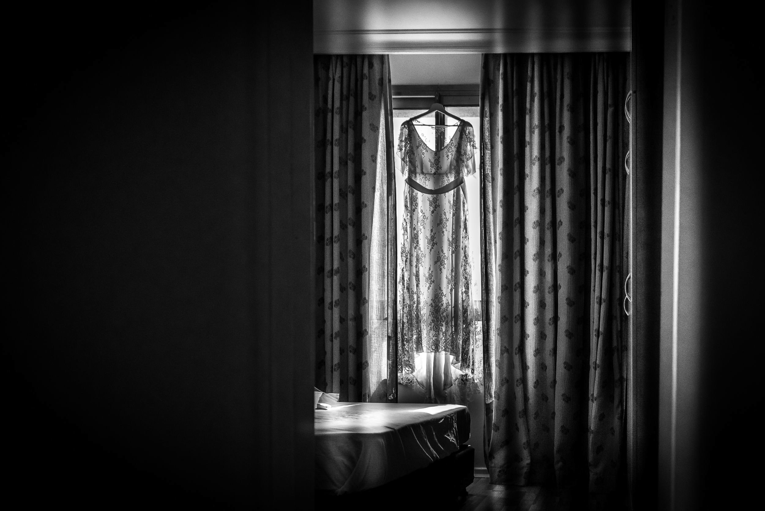 Bride Simone's wedding dress hanging by the window at the Leonardo Hotel in Haifa, Israel