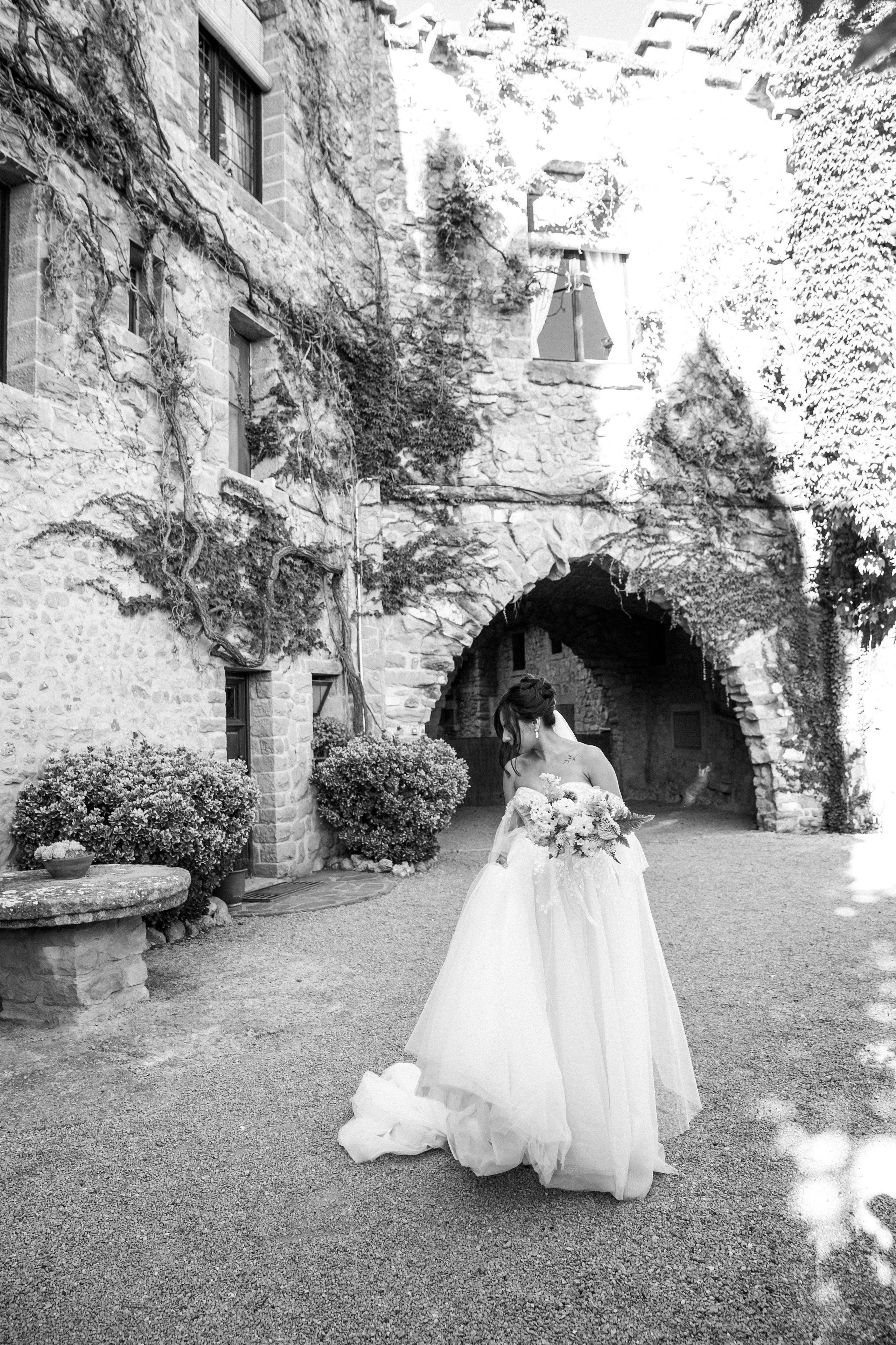 A beautiful bridal portrait showcases her dress and bouquet during the photo session at the La Baronia wedding venue