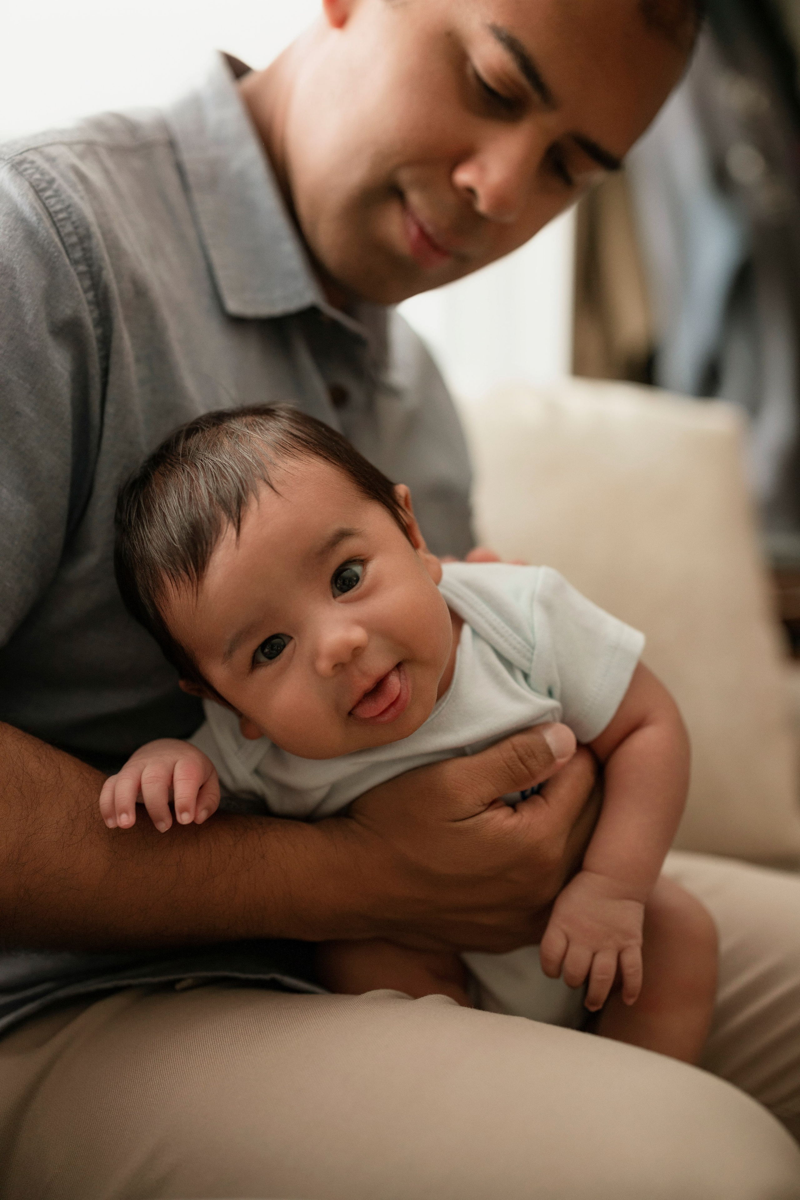 Relaxed family portraits with newborn baby at home