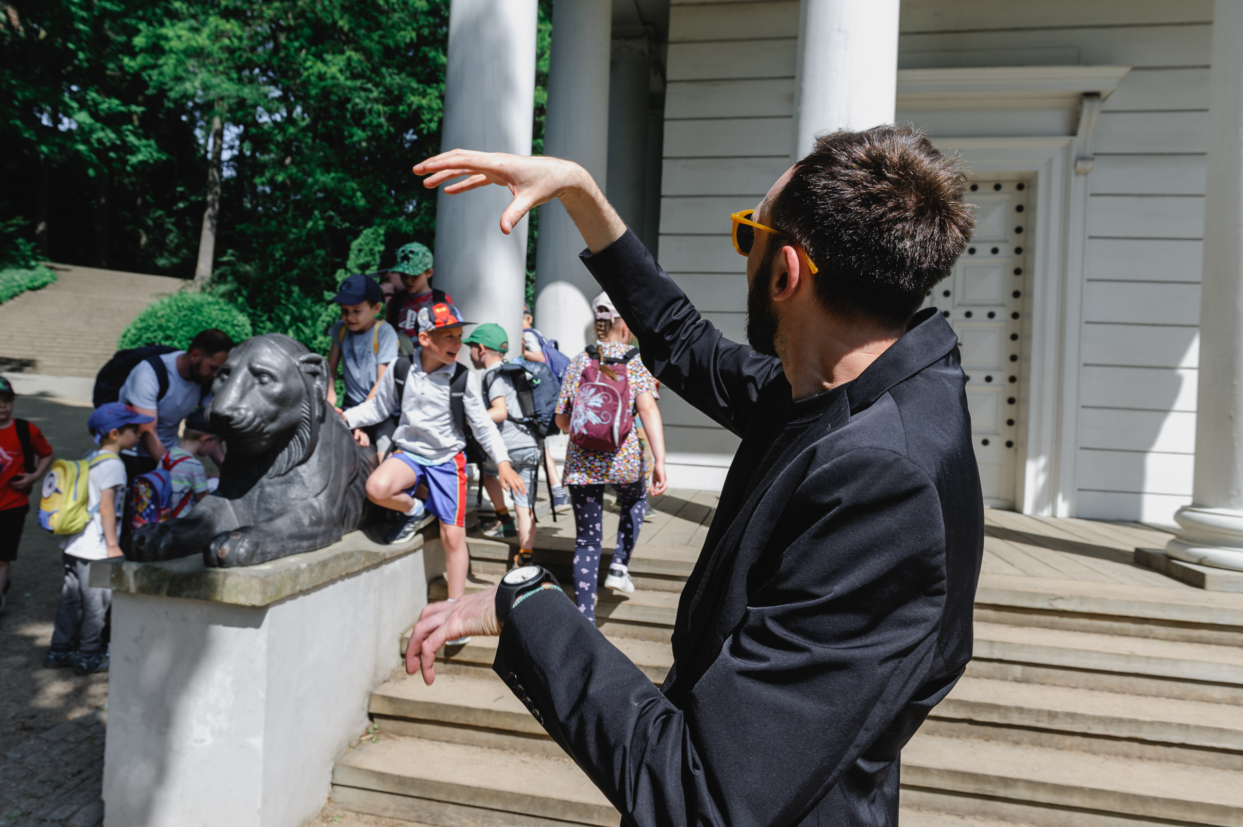 Cultural scholar Dmitry Solodkiy gestures with his hands, creating the image of a crocodile.