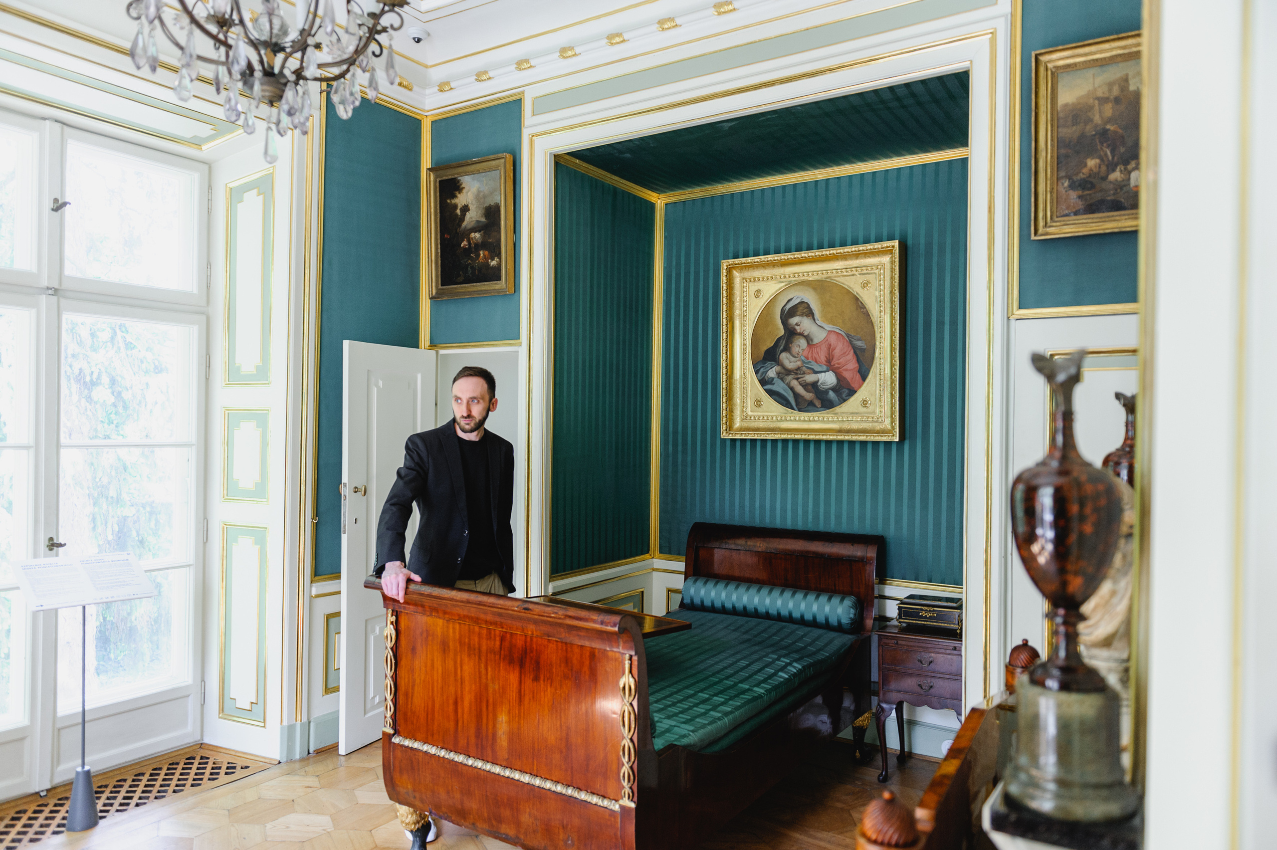 Art historian Dmitry Solodkiy in a bedroom. The Royal Baths Museum in Warsaw.