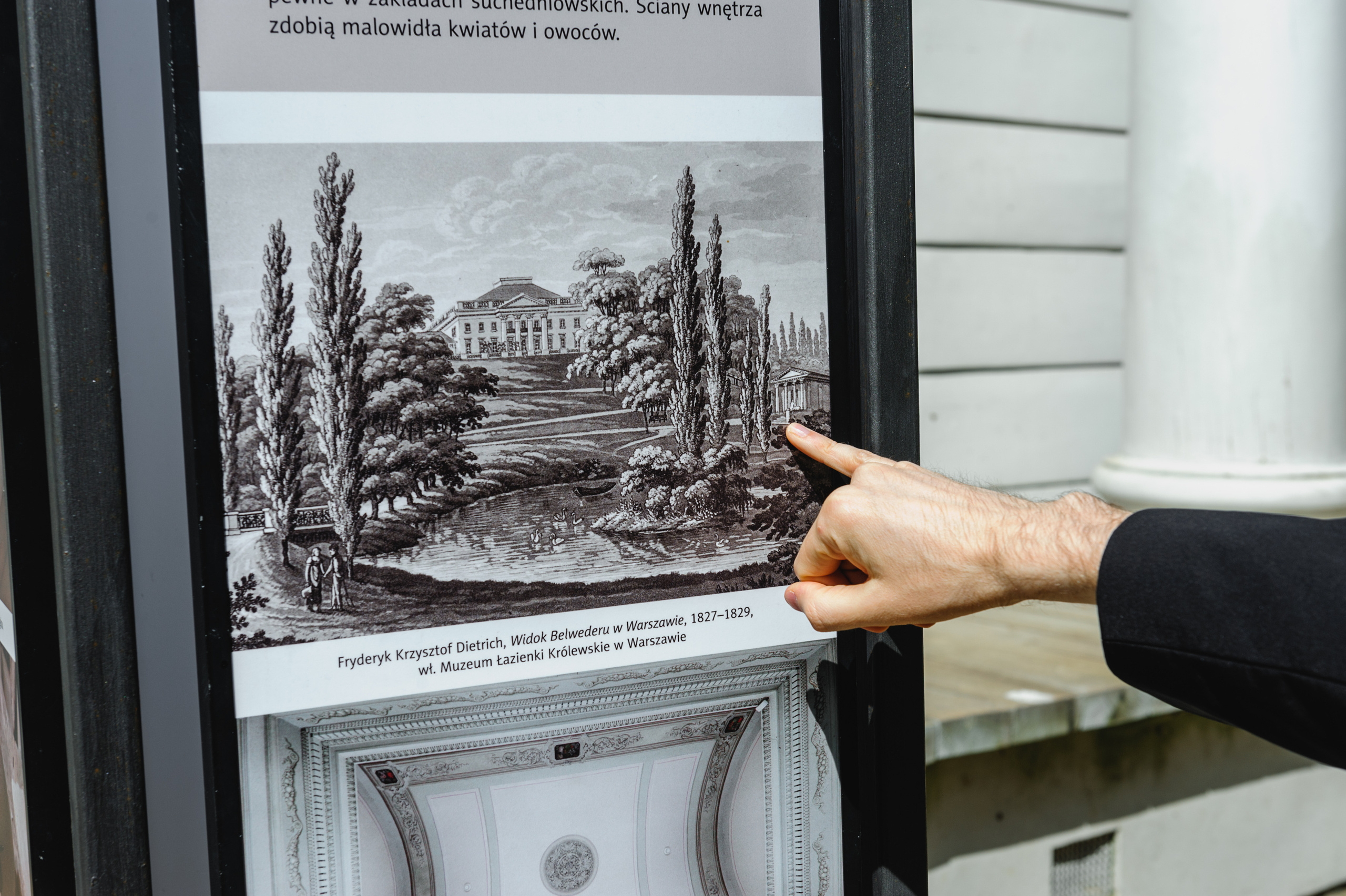 Art historian Dmitry Solodkiy points to a historical photograph of the Sibyl's Temple in the Royal Baths.