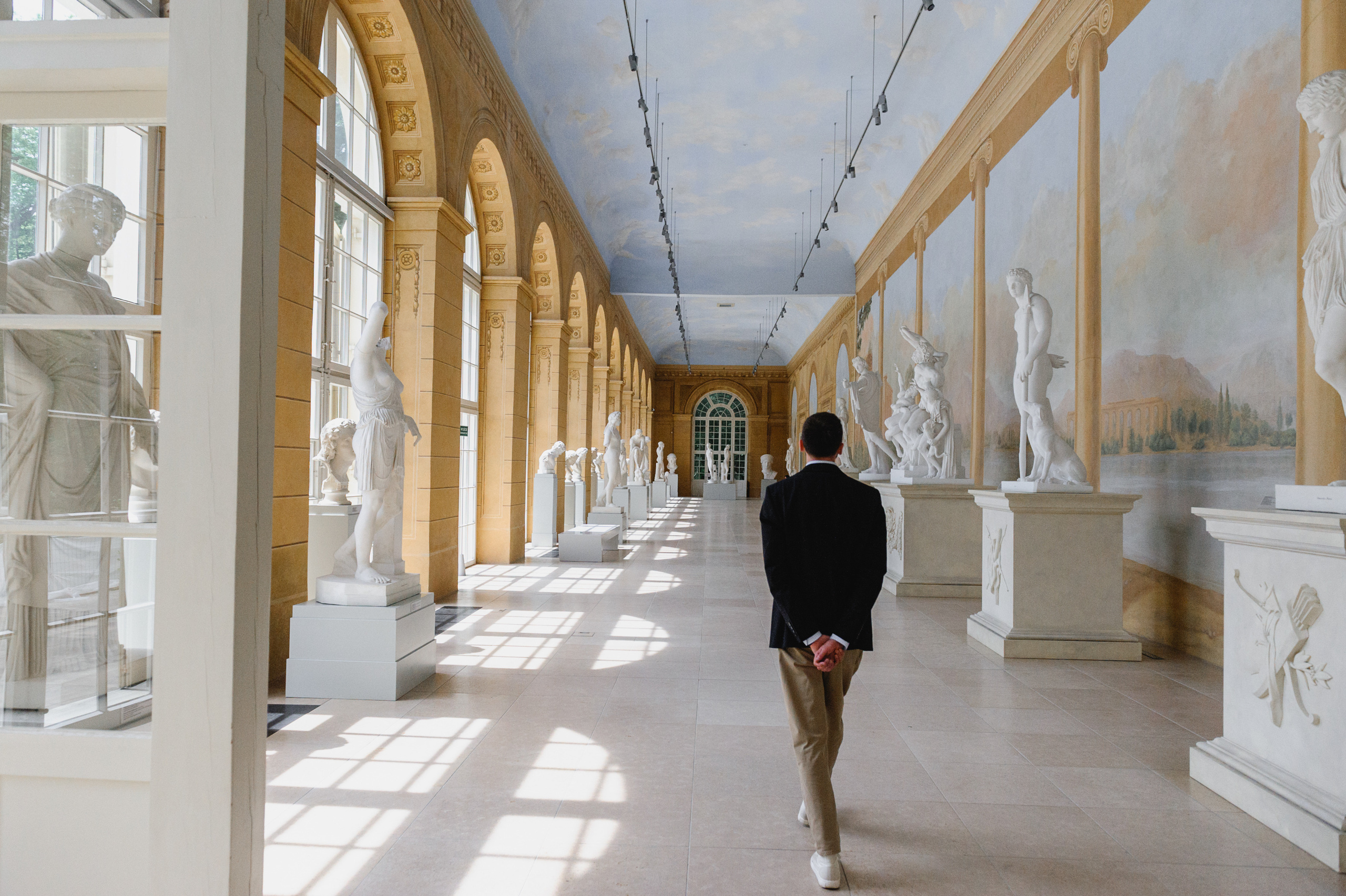 Cultural scholar Dmitry Solodkiy in the sculpture hall. The Royal Baths Museum in Warsaw.