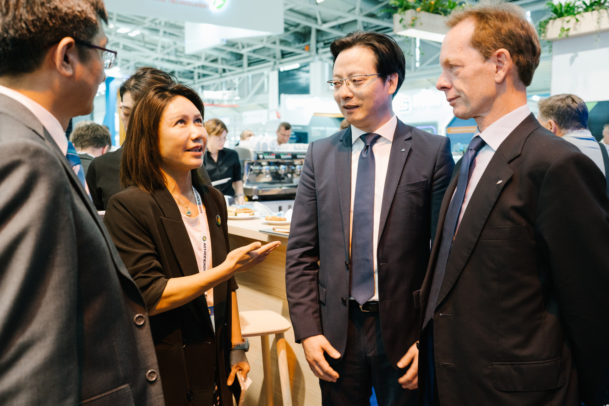Two executives networking at an international trade fair