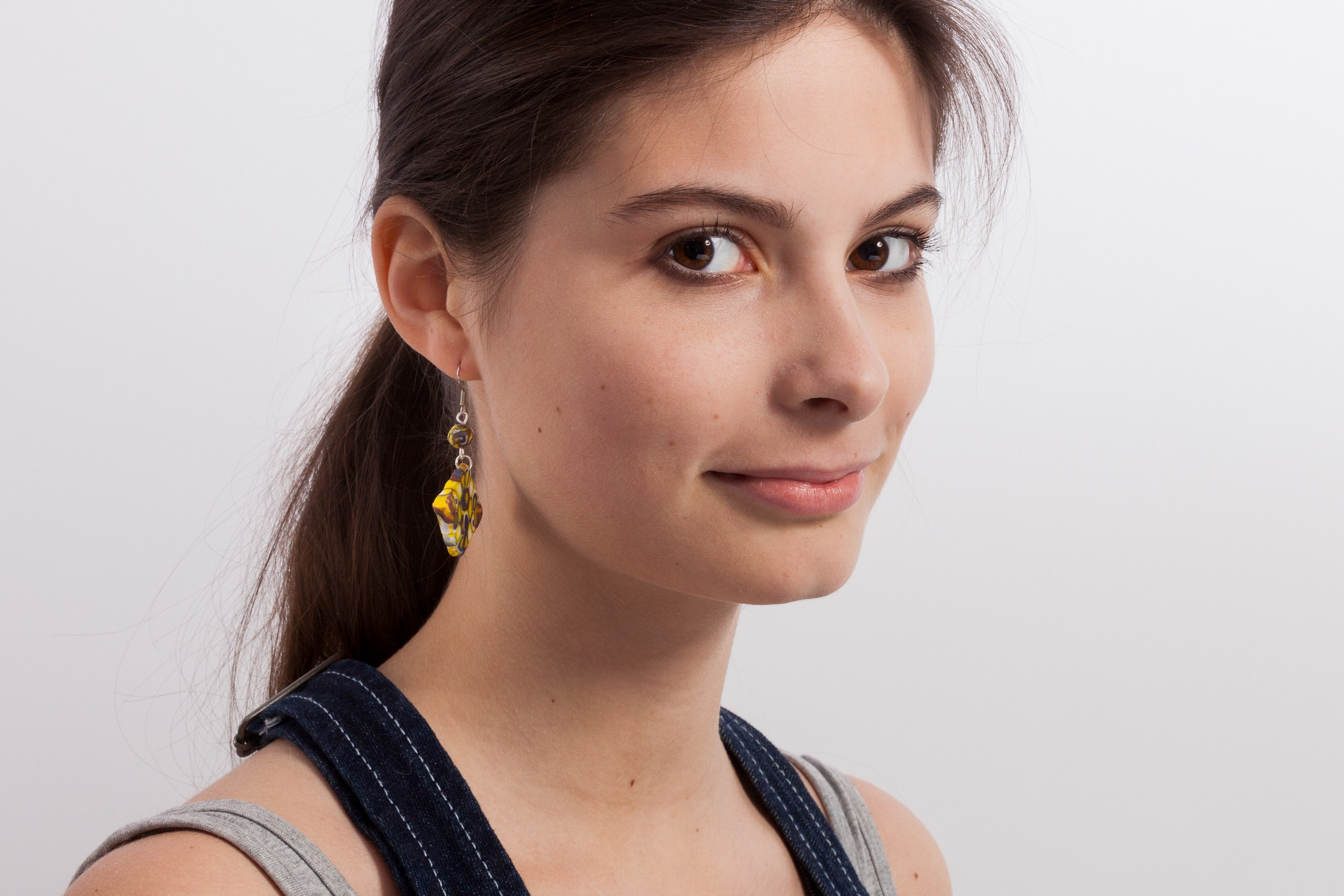 Closeup portrait of a young girl on white studio background - photographer Andrey Dunin