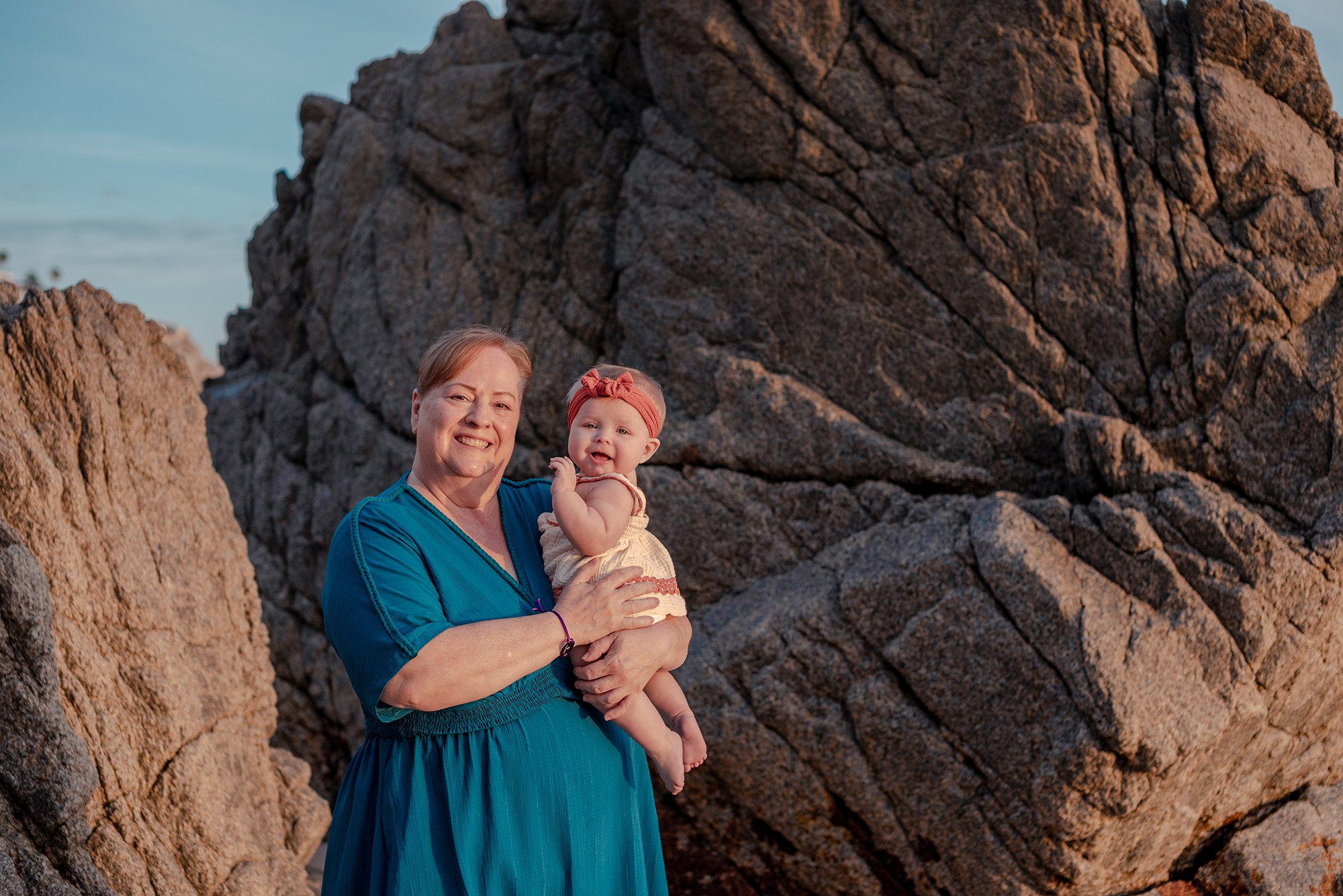 baby and grandmother during vacation family photography session at Playa Monumentos near El Arco Cabo San Lucas