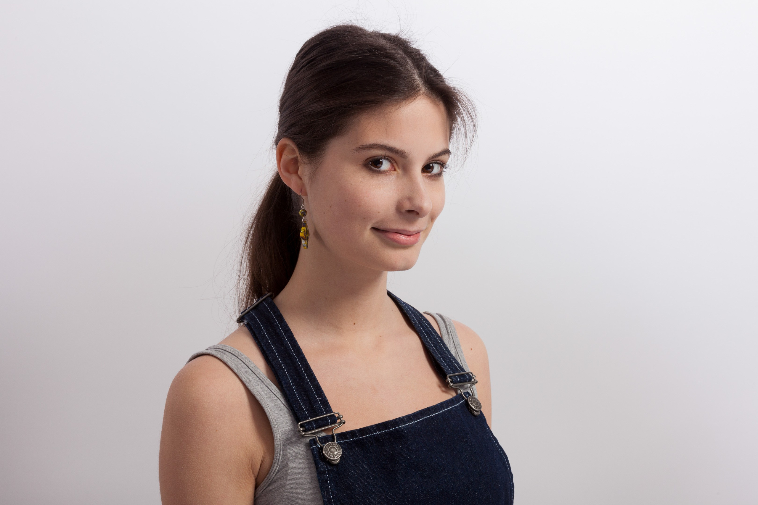 Portrait of a young girl on white studio background - photographer Andrey Dunin