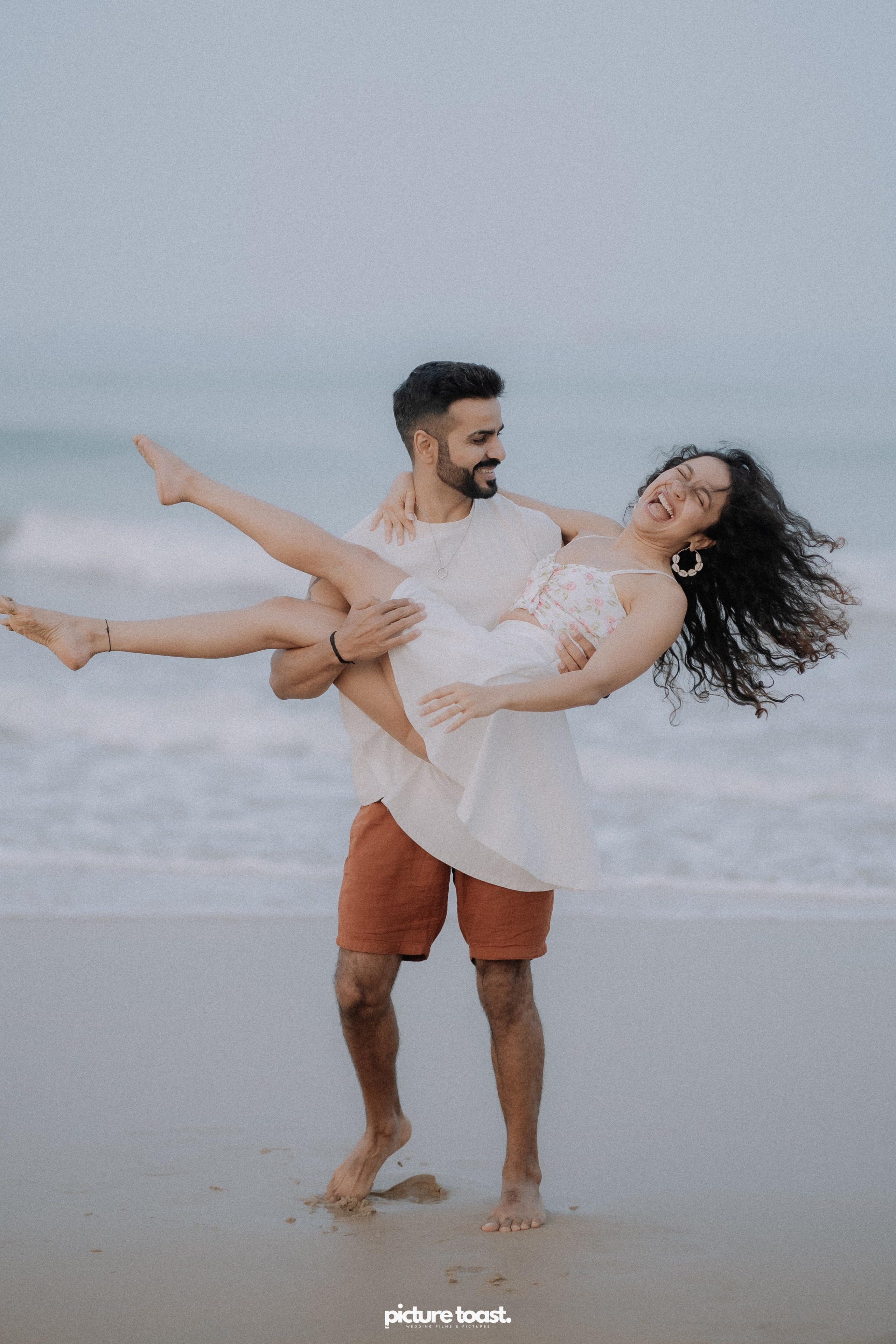 Love In The Beach. Fine art Wedding Photographers in India & Canada