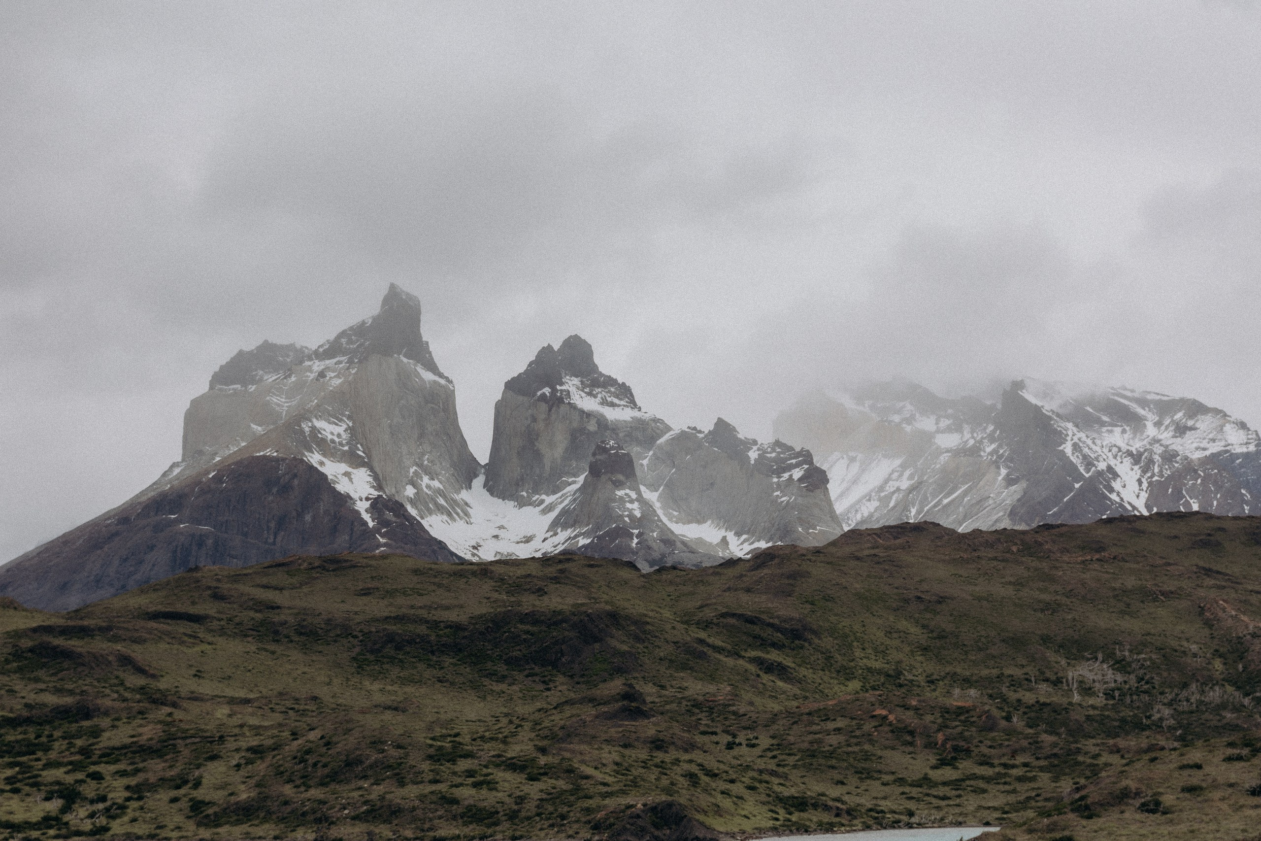 Torres del Paine mountains covered by clouds in Patagonia