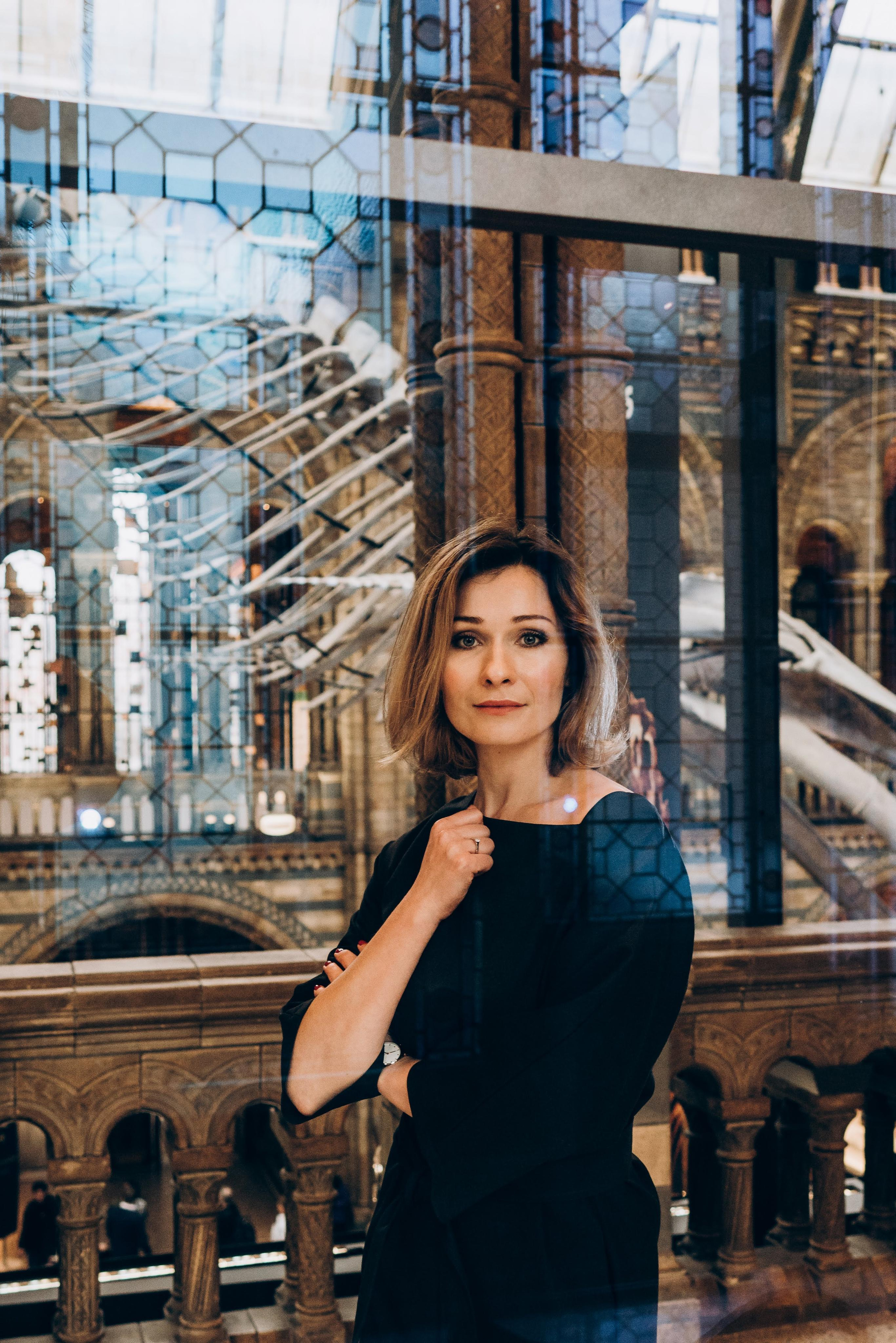 women standing behind the glass 
