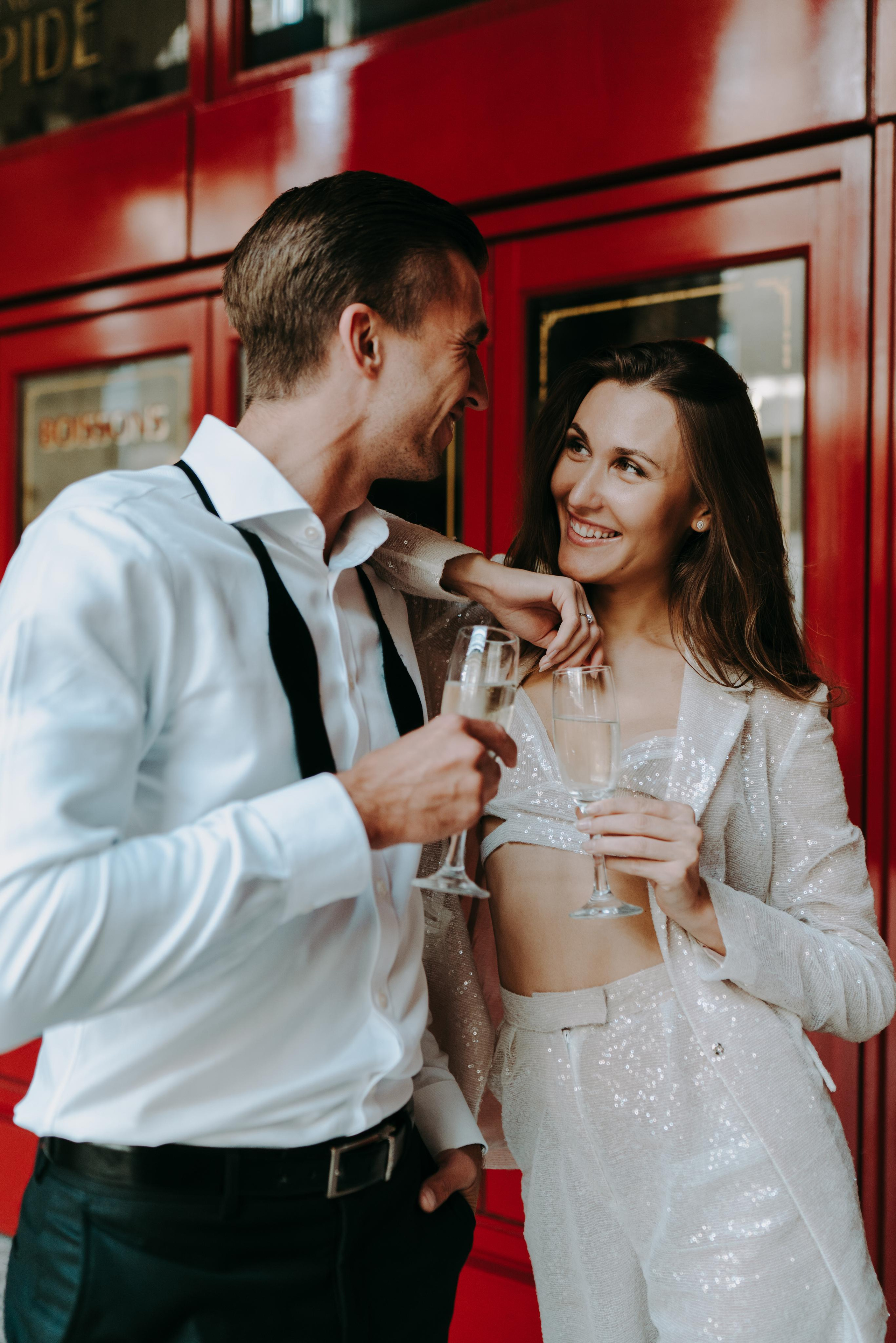 couple chatting and drinking sparkling wine 