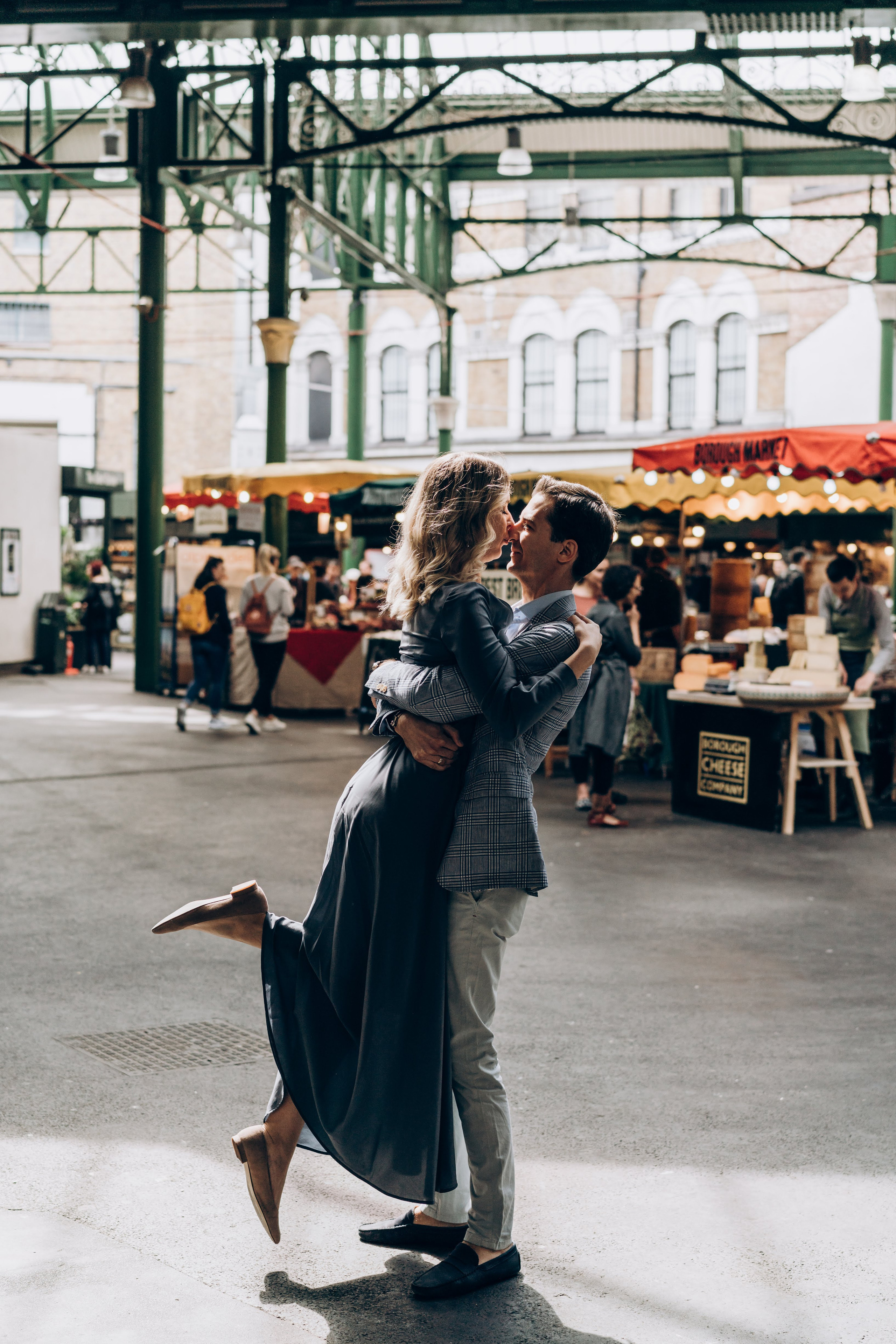 young couple is kissing inside the market 