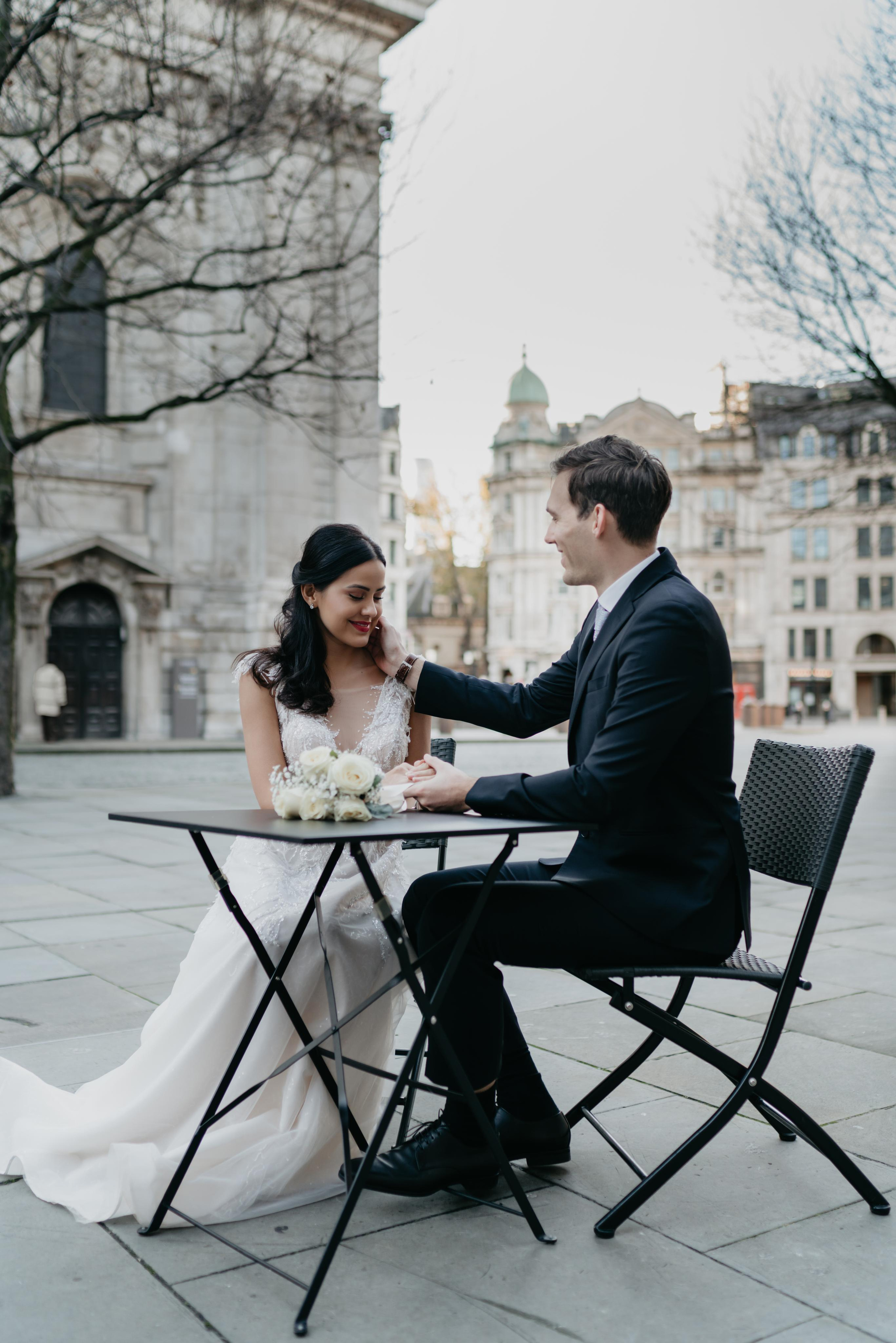 young couple sitting by the table 