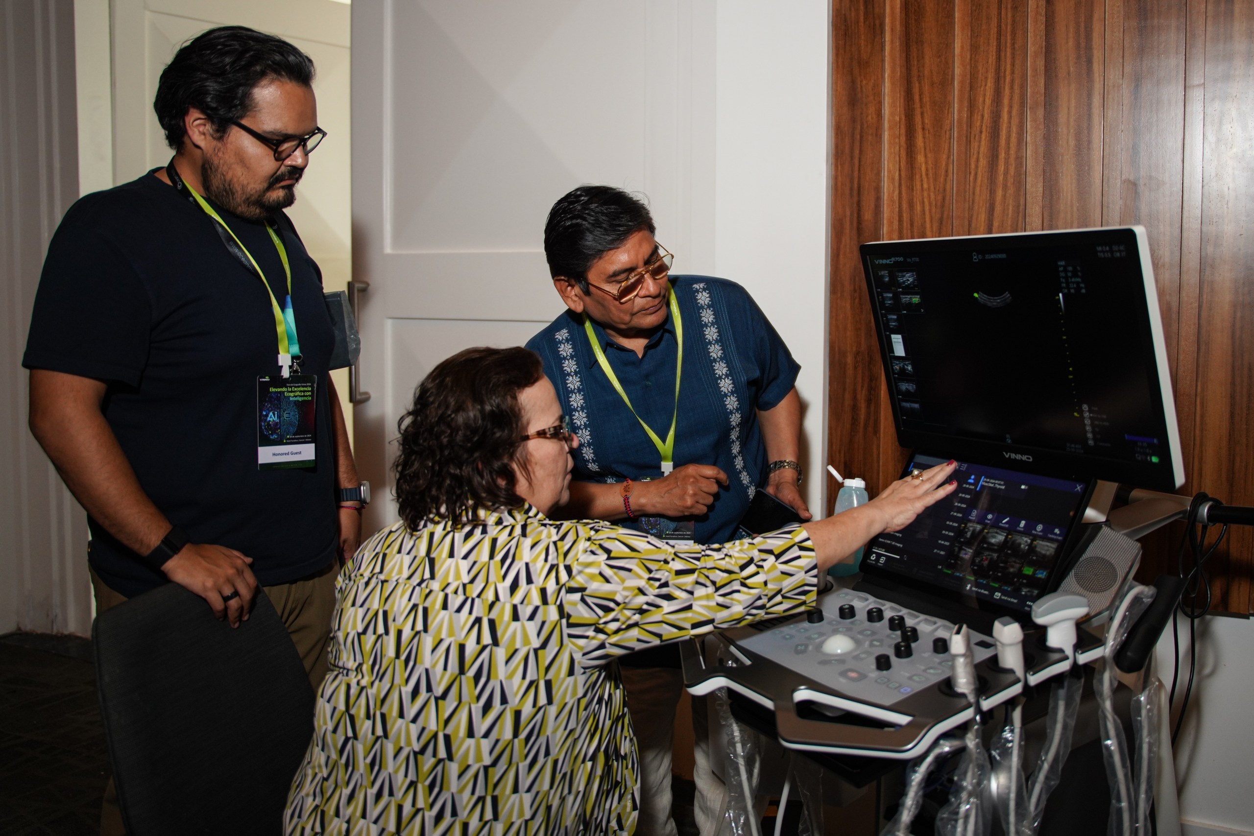 Demonstrator showcasing hands-on functionality of advanced imaging device.