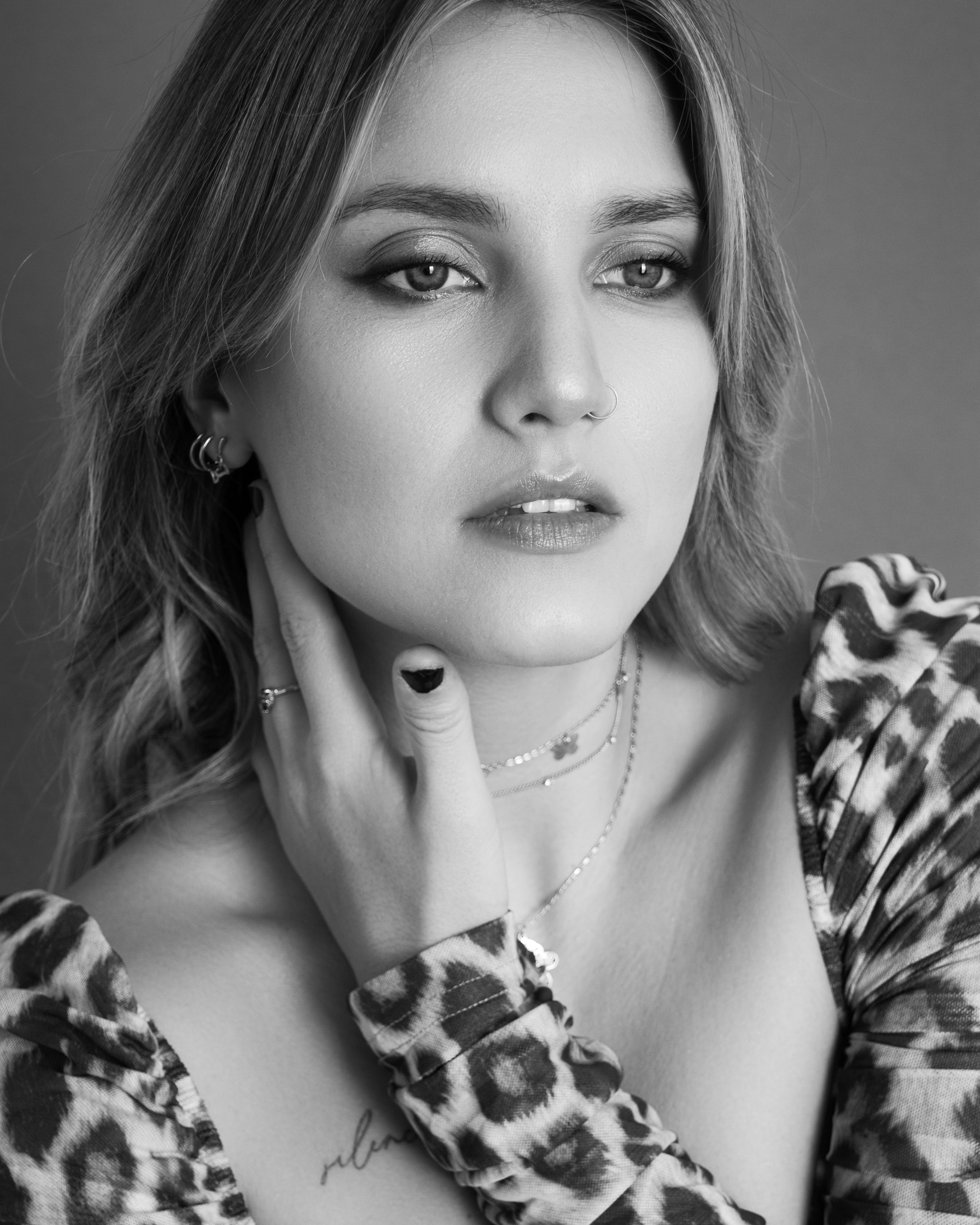 Utah black and white portrait photography, elegant studio photo of woman in leopard print at Shtatolkina Studio