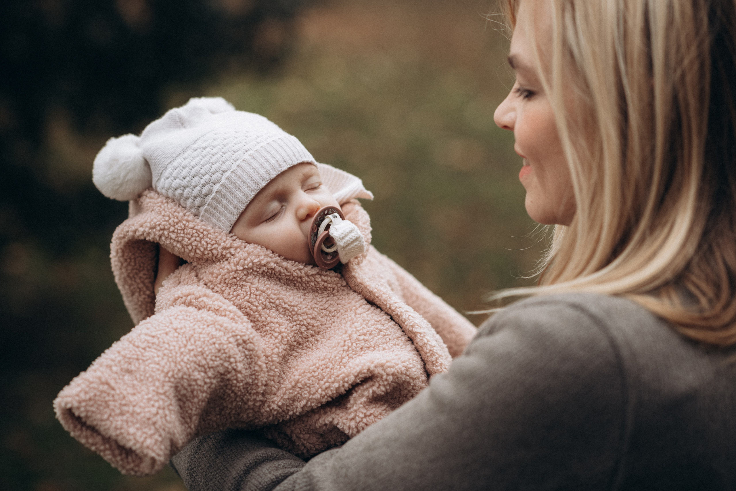 mother holds her baby 