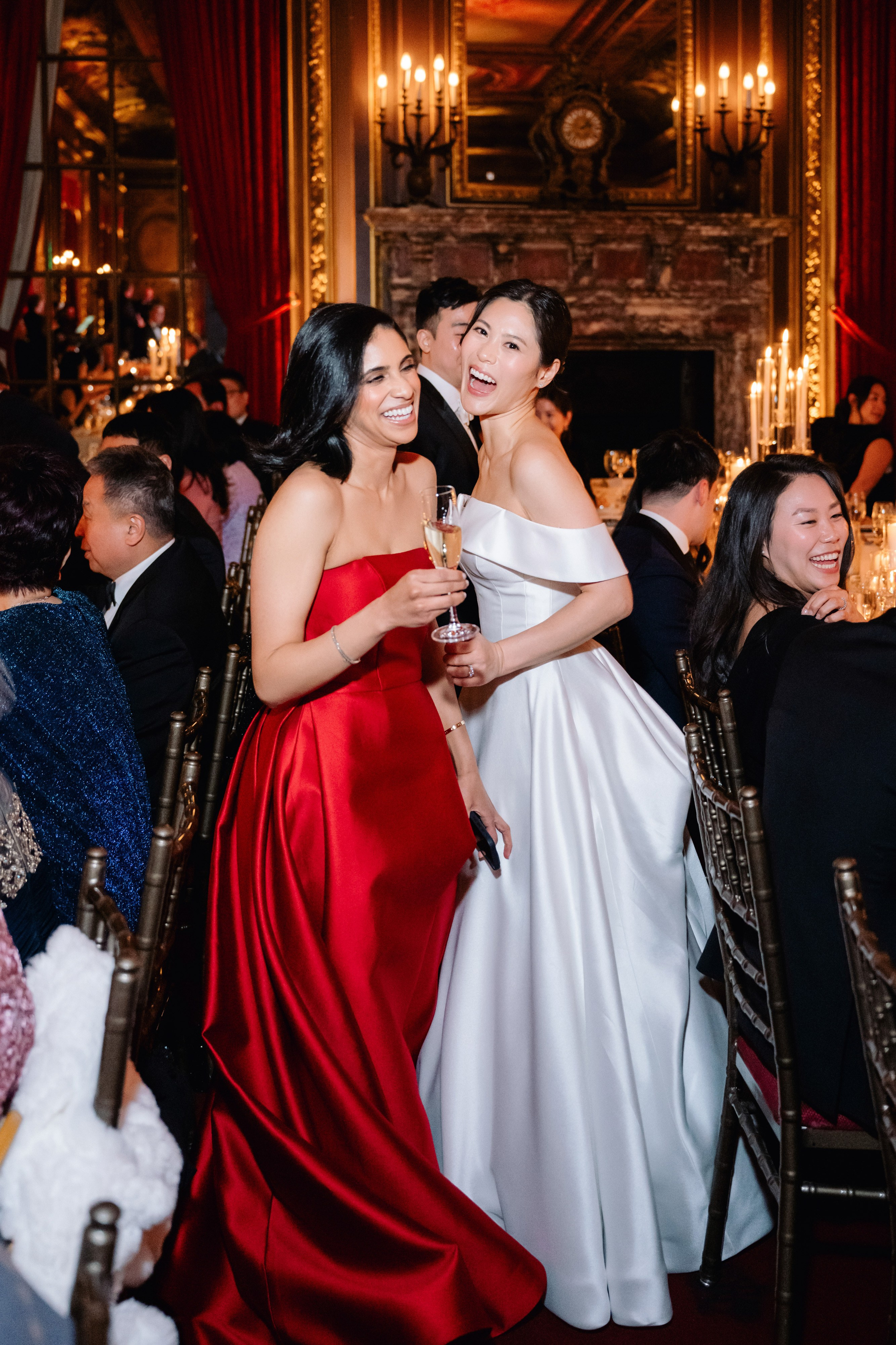 two women in red dresses