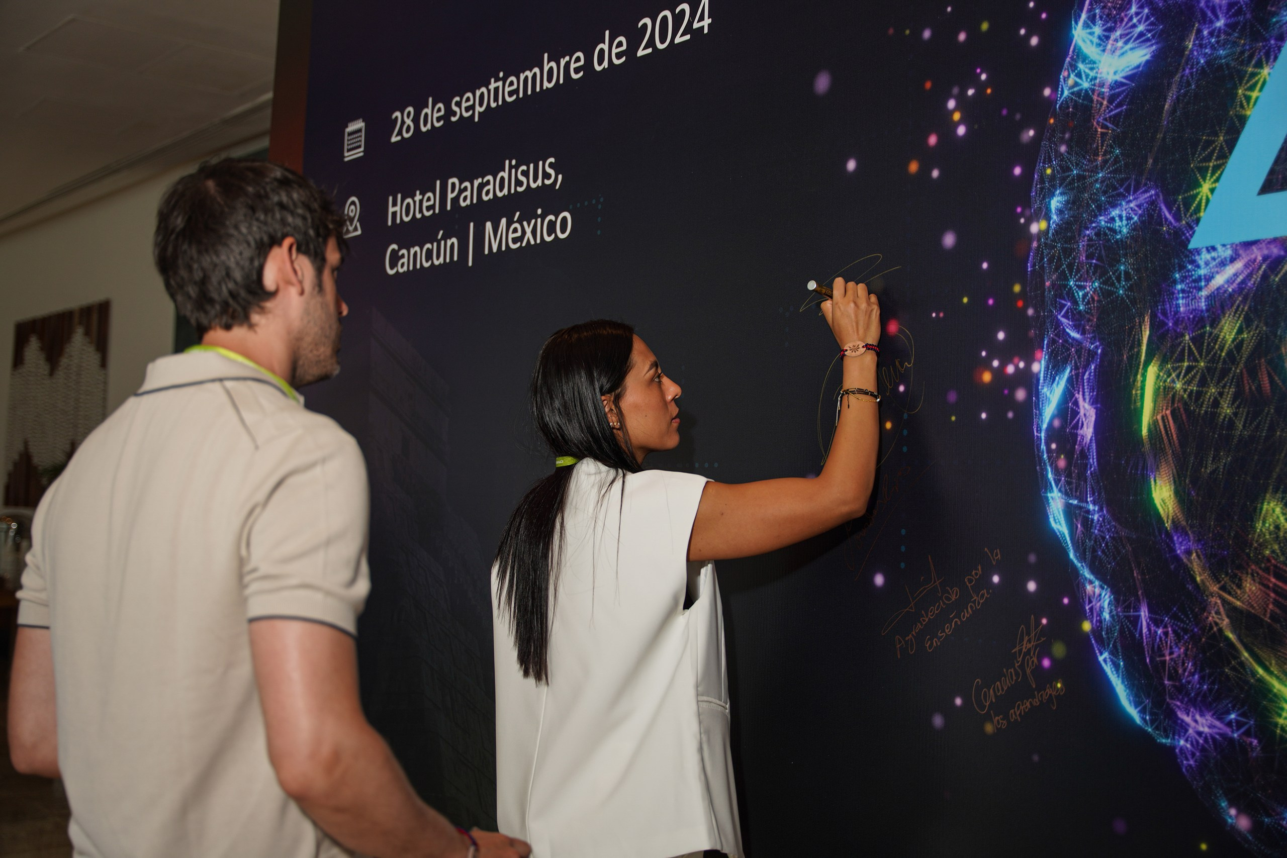 Guest smiling during corporate networking moment.