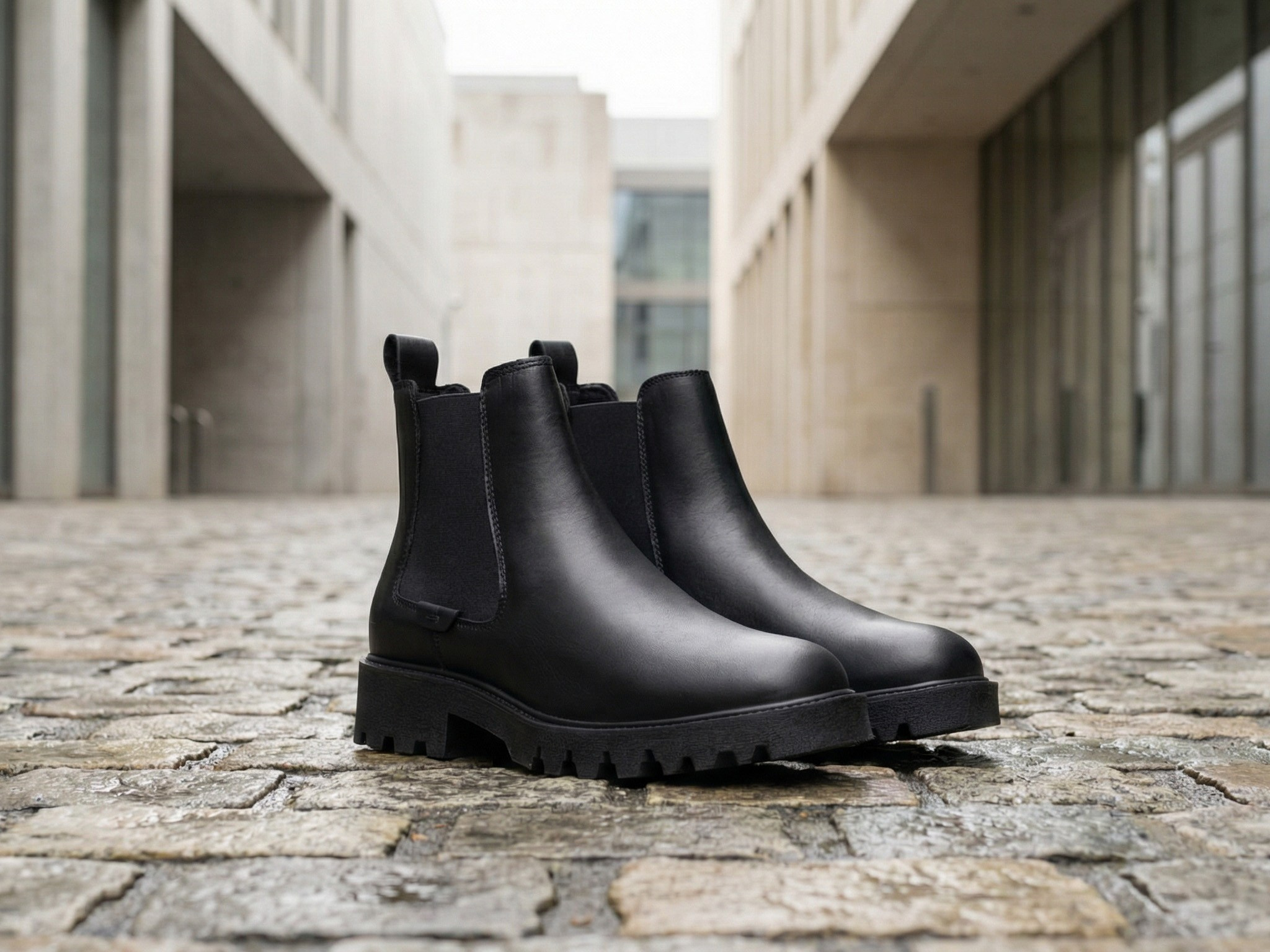AI product visualization black Chelsea boots architectural setting lifestyle photography