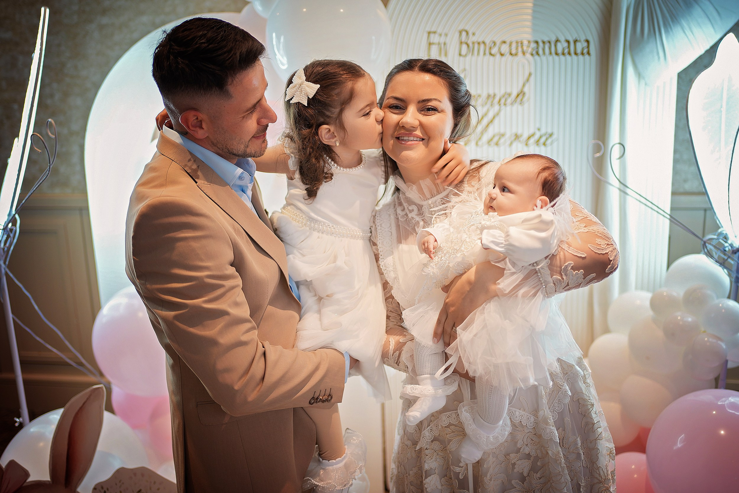 Family posing together at a Munster baptism celebration.