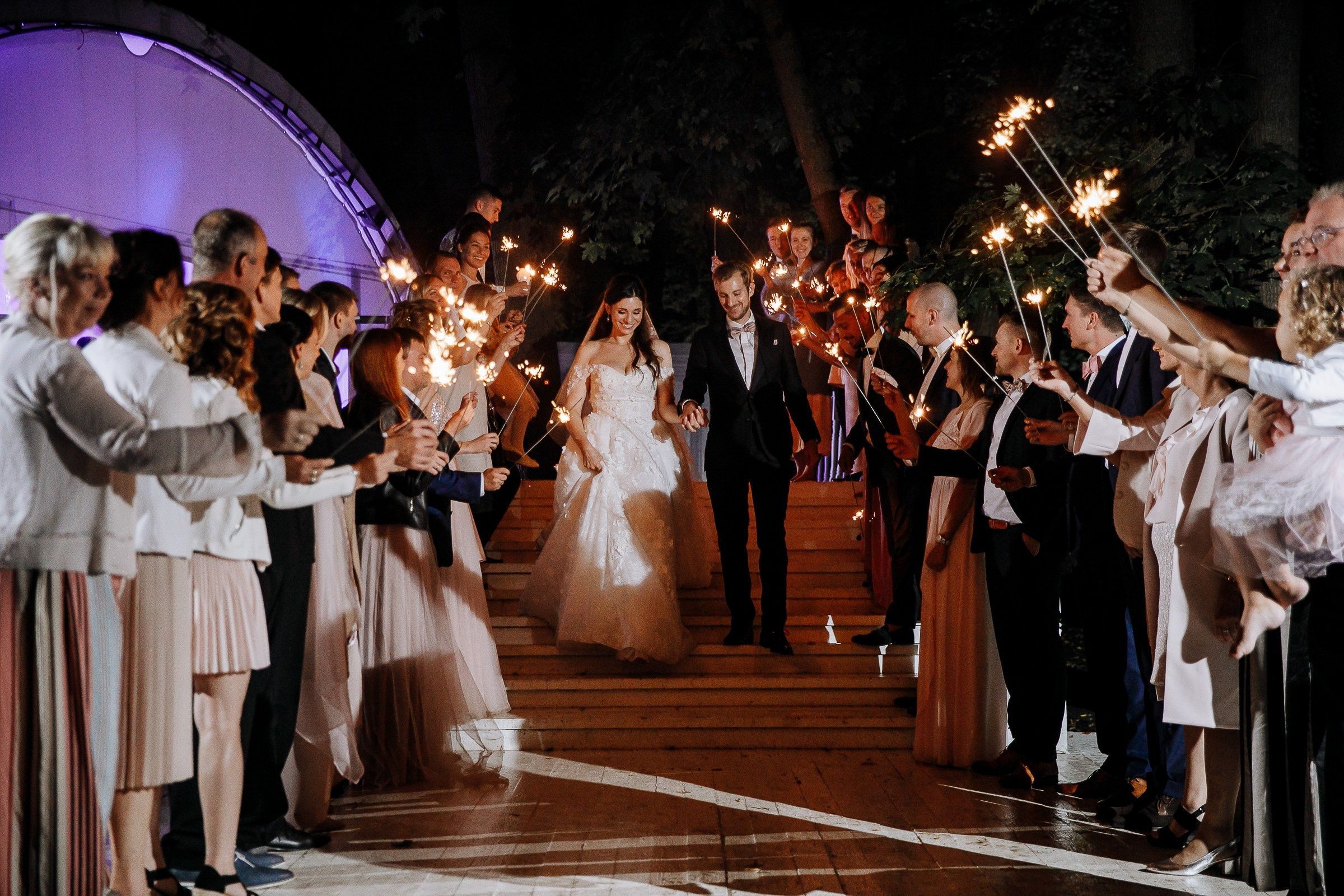 Guests with sparklers, by Cornwall wedding photographer.