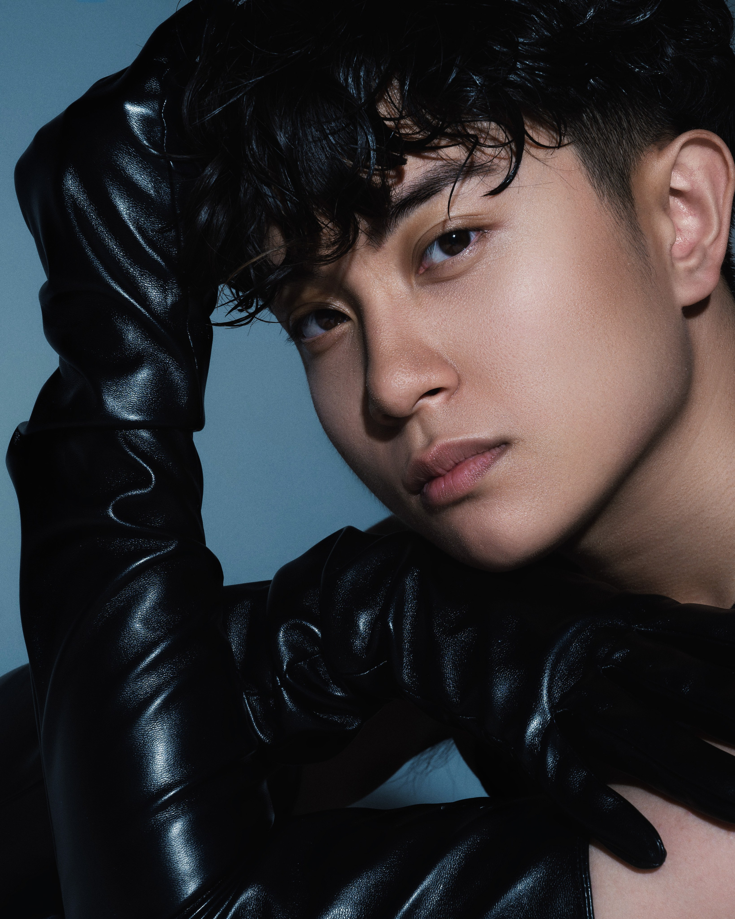 High-fashion male portrait in the studio with hard lighting, model test session for portfolio.