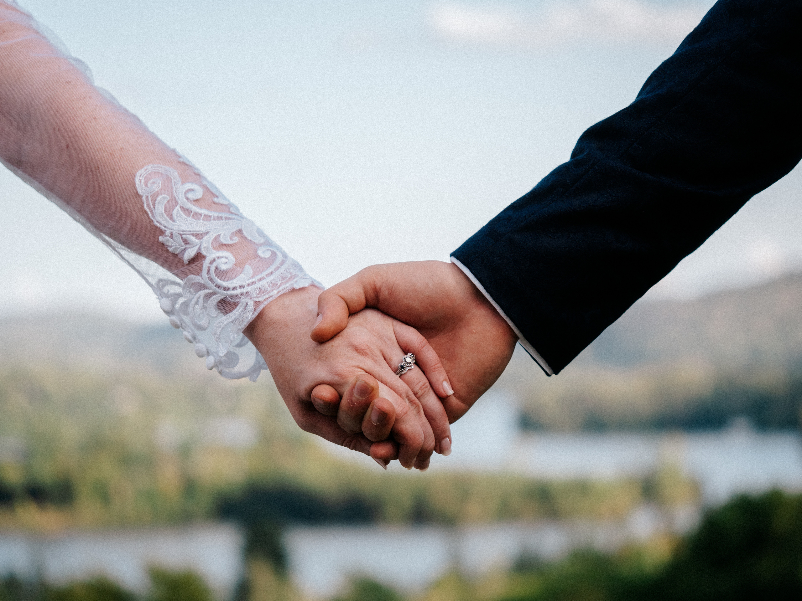 Close up of couple holding hands in Sainte-Agathe-des-Monts, Quebec. 