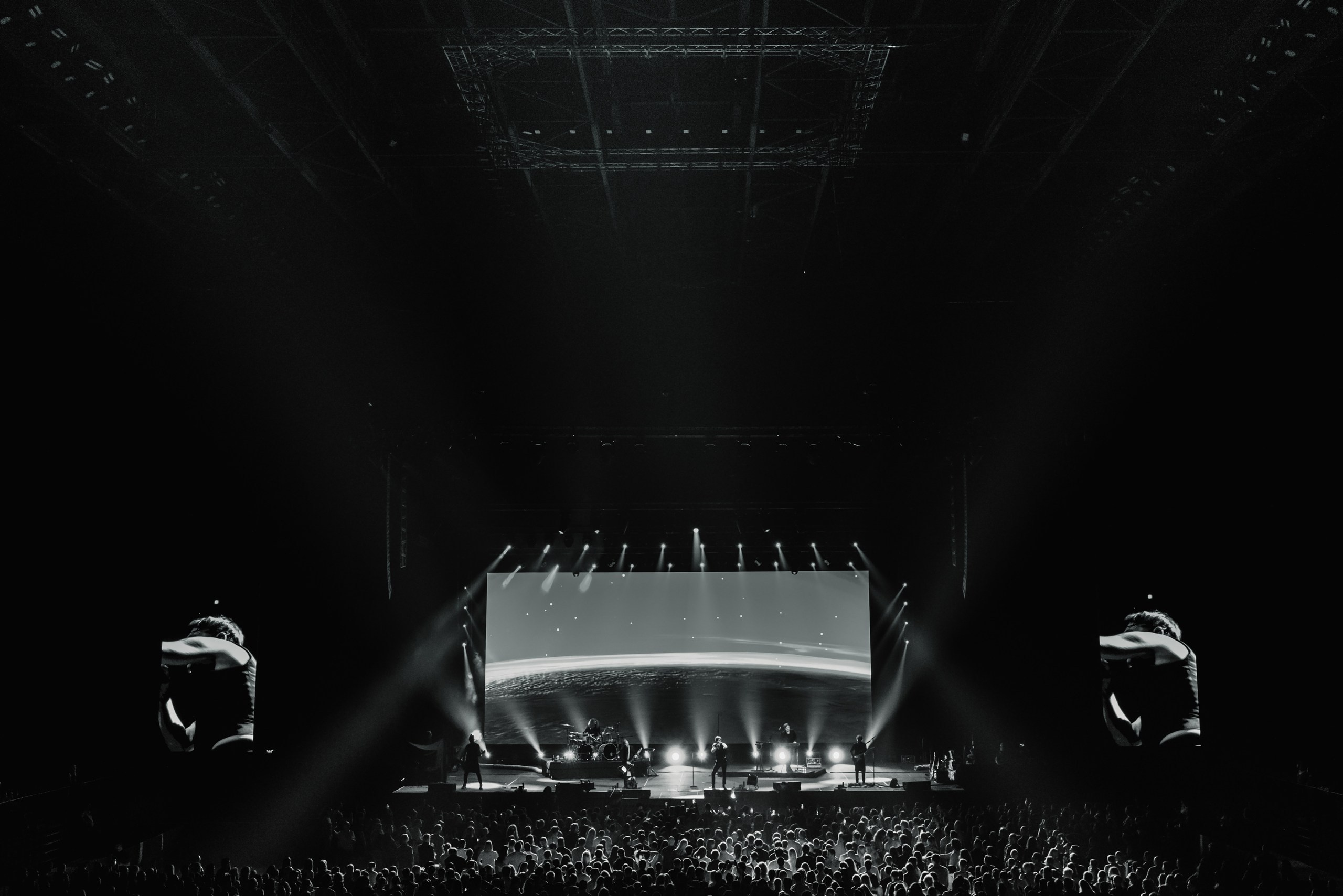 The fusion of international crowds dancing under a state-of-the-art lighting rig.