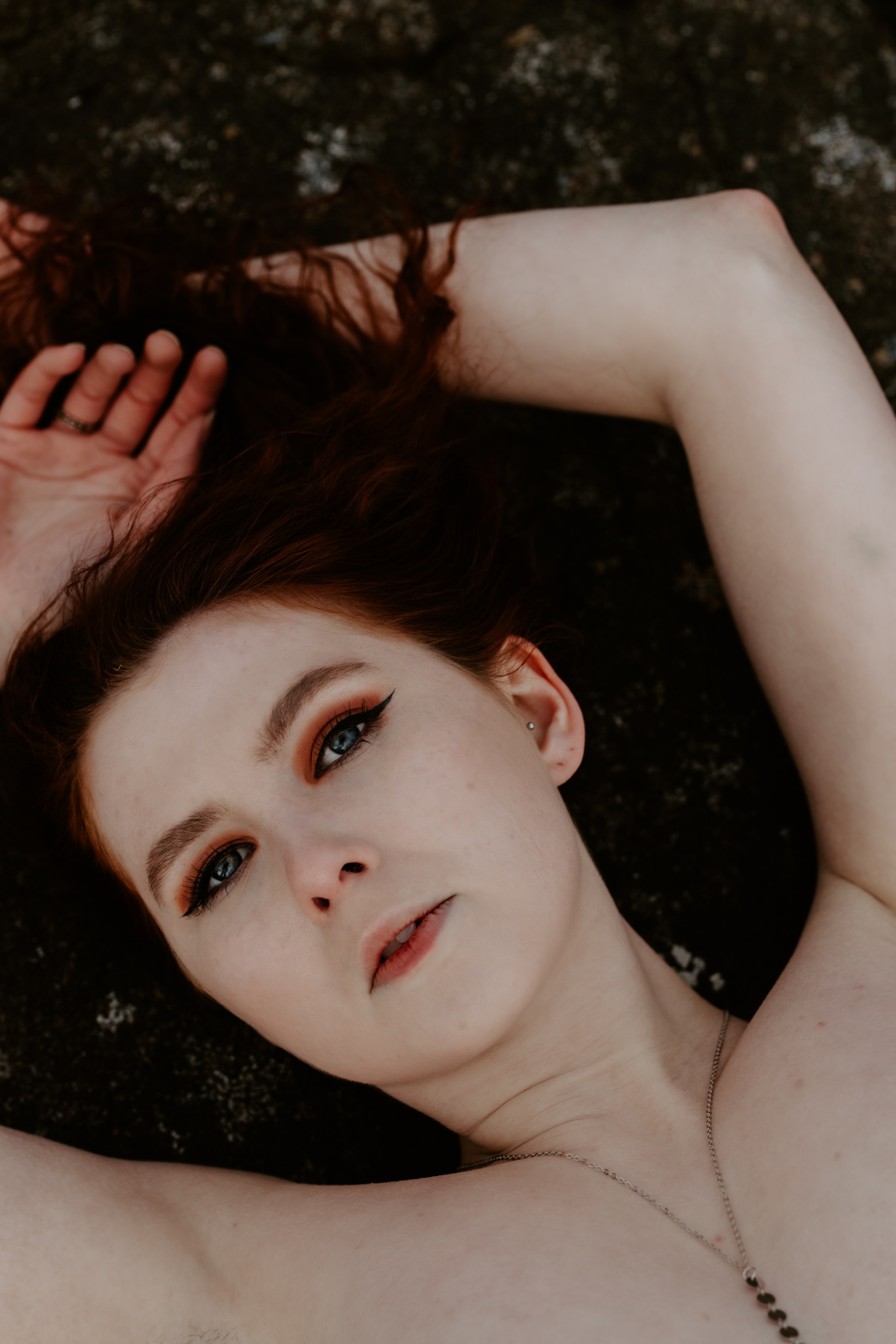 Empowering outdoor boudoir session in Iceland’s wild nature, embracing confidence and self-expression.