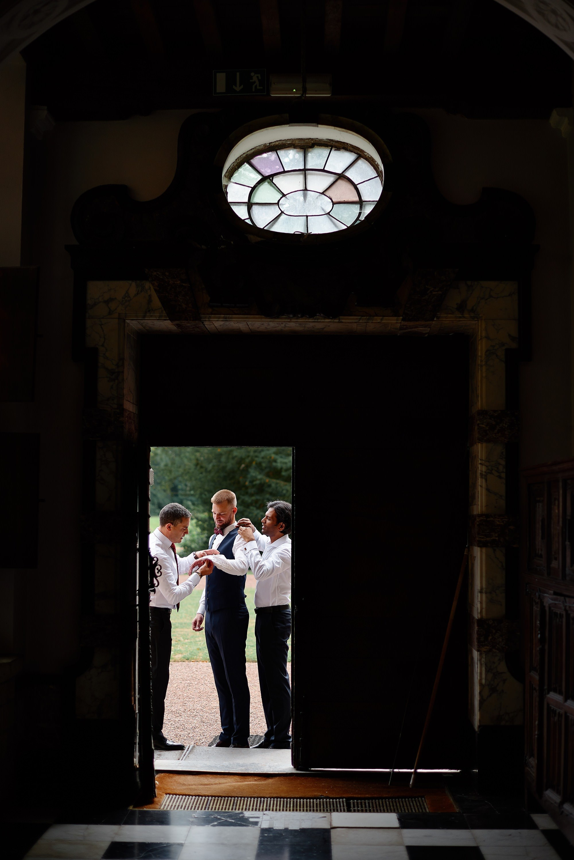 Groom getting ready at Groot-Bijgaarden Castle Brussels Belgium