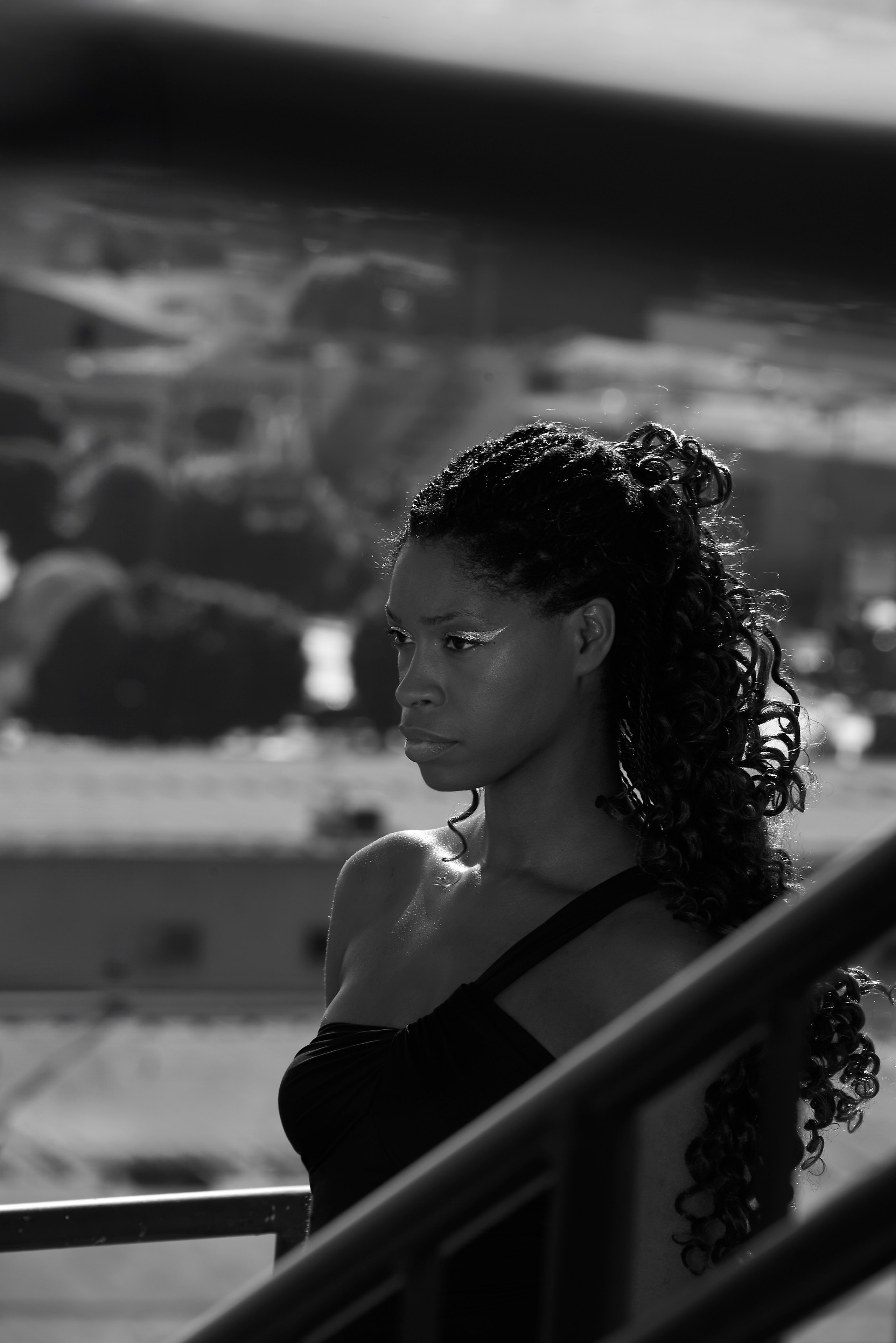 Moody black and white close-up of a woman looking away
