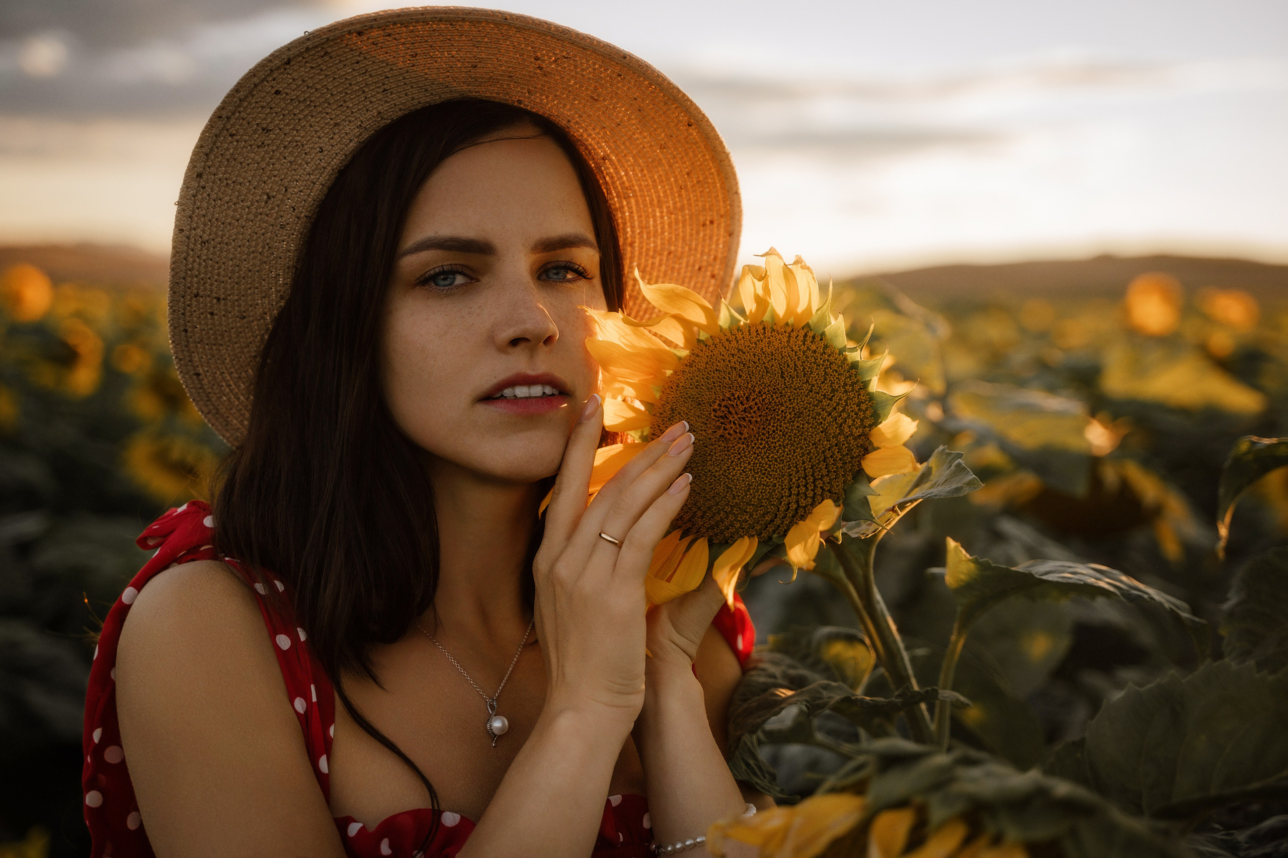 Young woman in sunflower field at sunset, Marbella portrait photographer