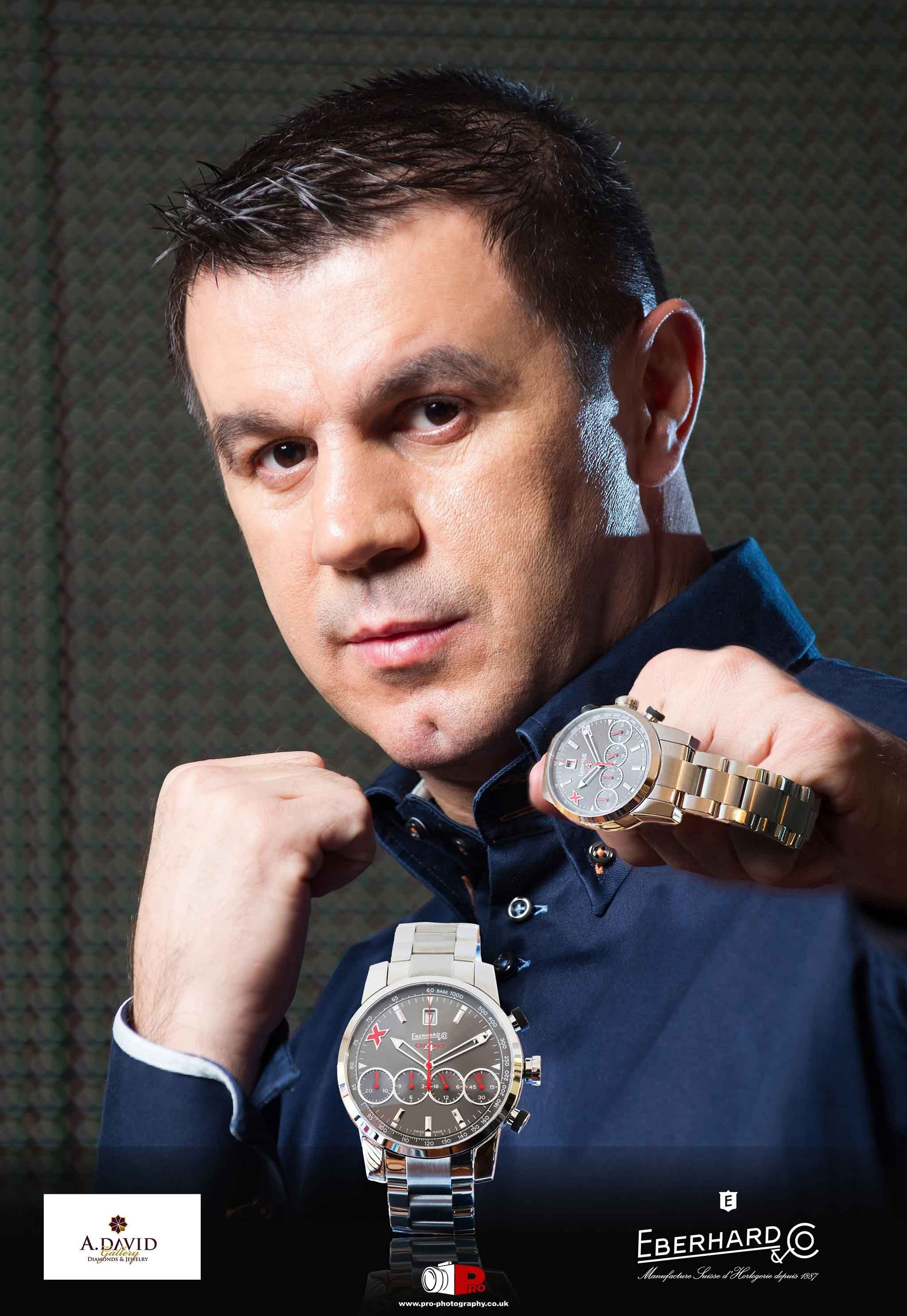 Commercial portrait of a man presenting luxury Eberhard & Co watches for a jewellery advertising campaign.