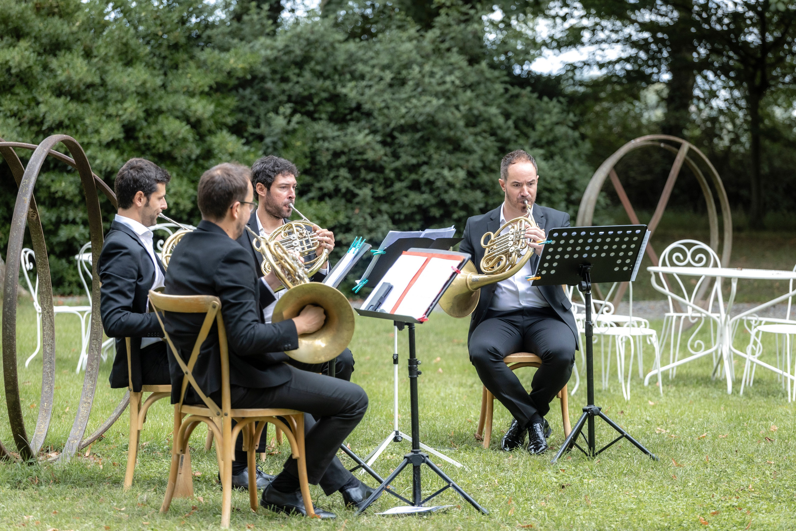 Live French horn ensemble performing during château wedding ceremony in Aude