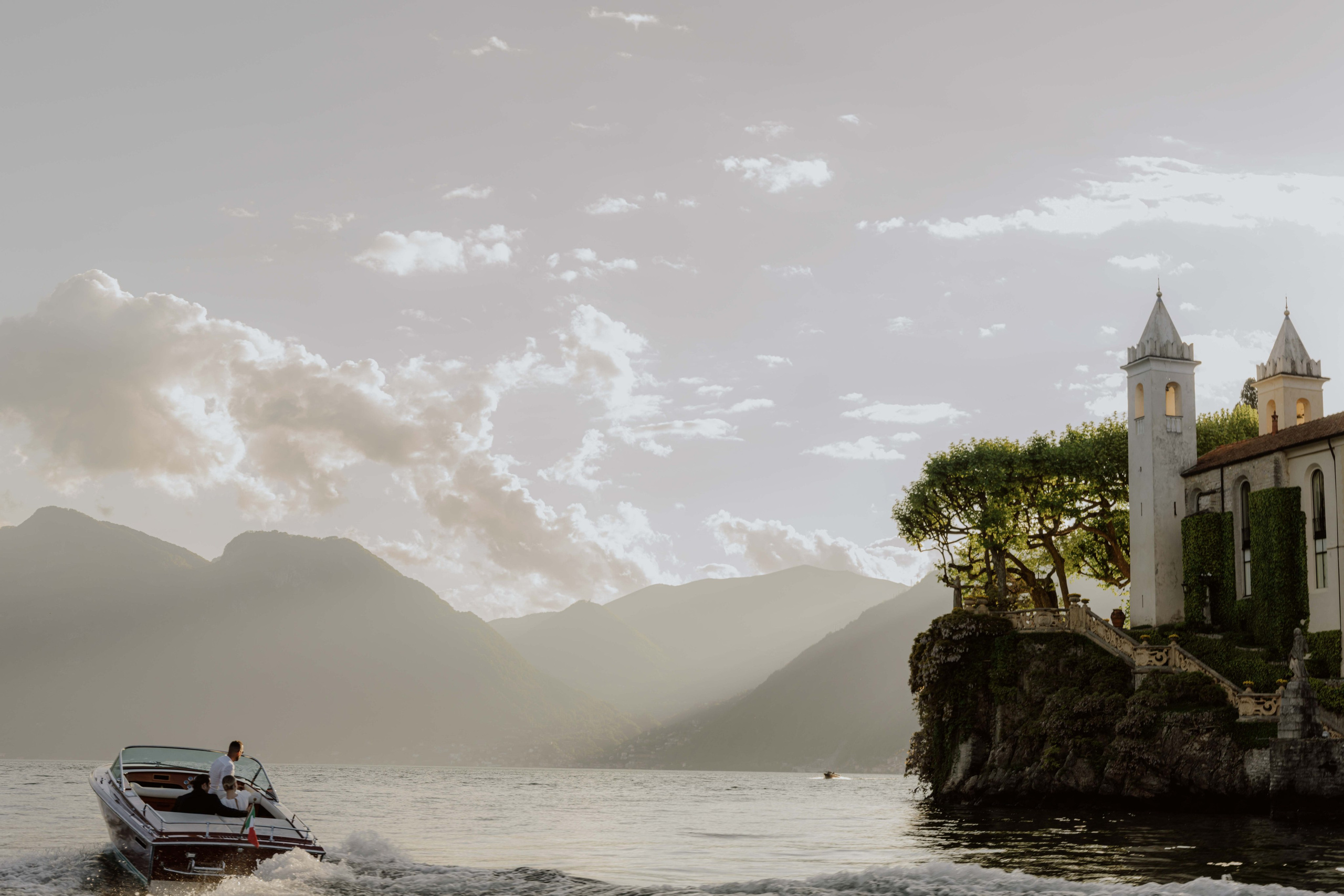     Lake Como elopement boat ride with mountain views in Italy