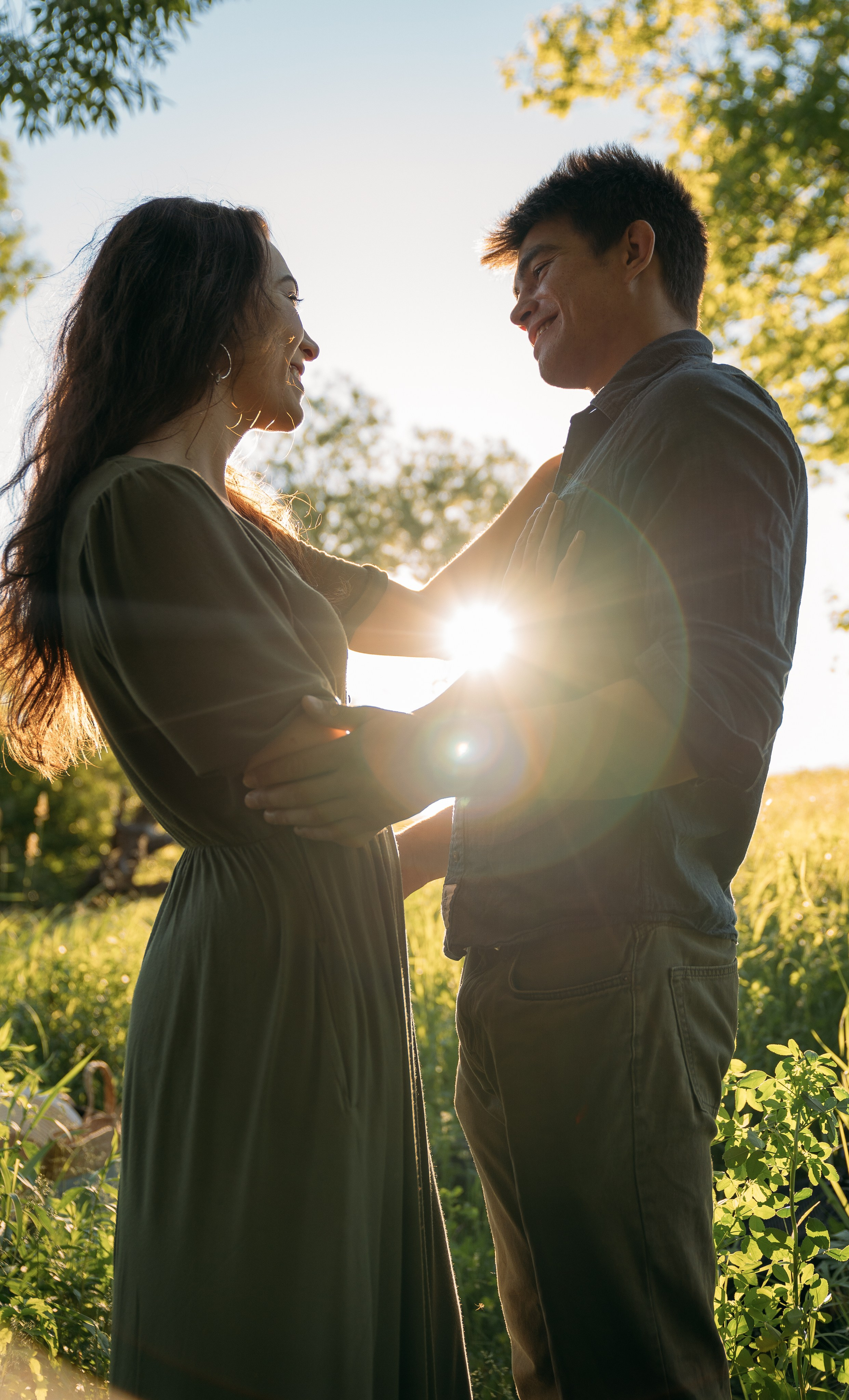 Сouple holding hands in a forest clearing