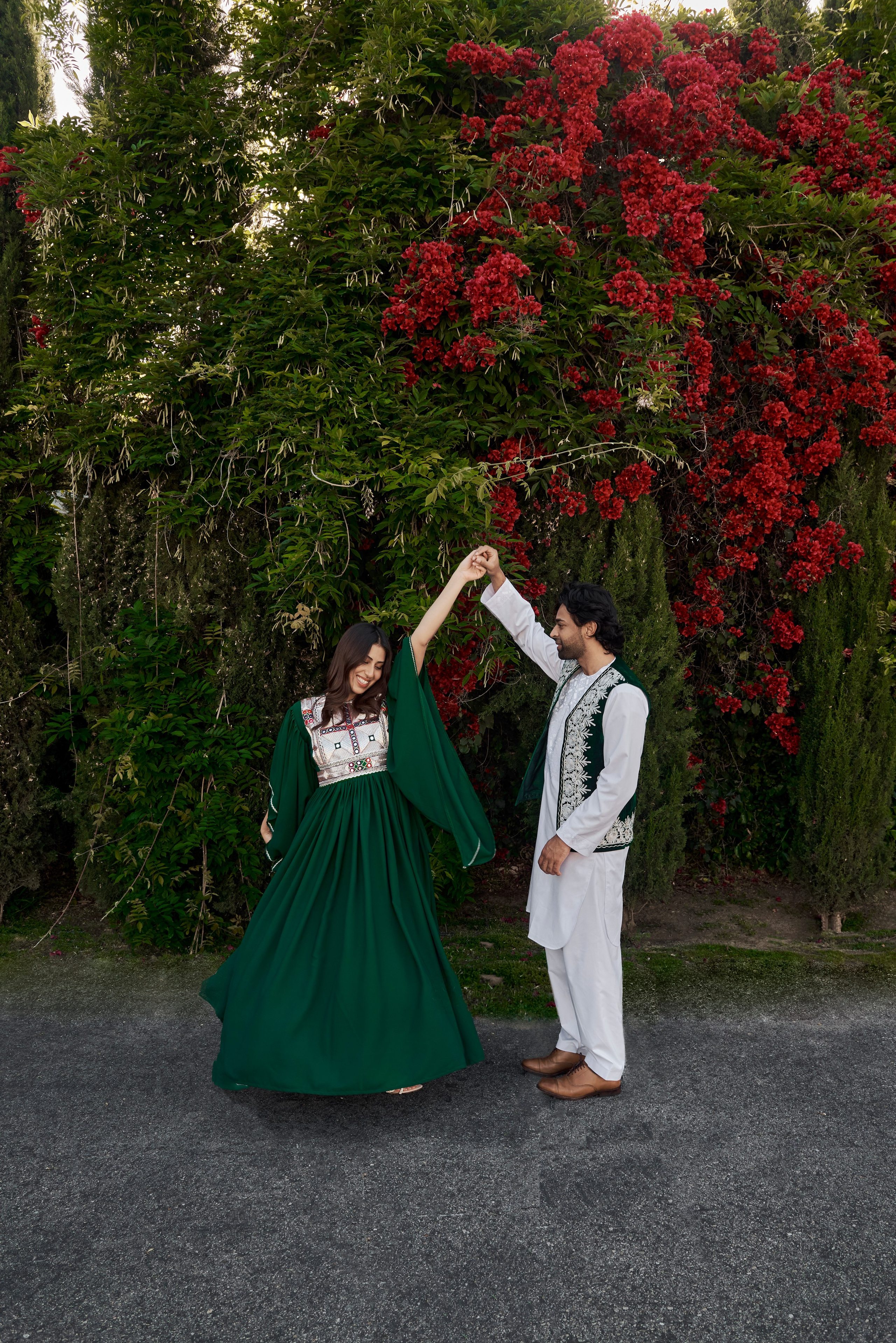 Dramatic engagement photo of a couple with Los Angeles skyline in the background