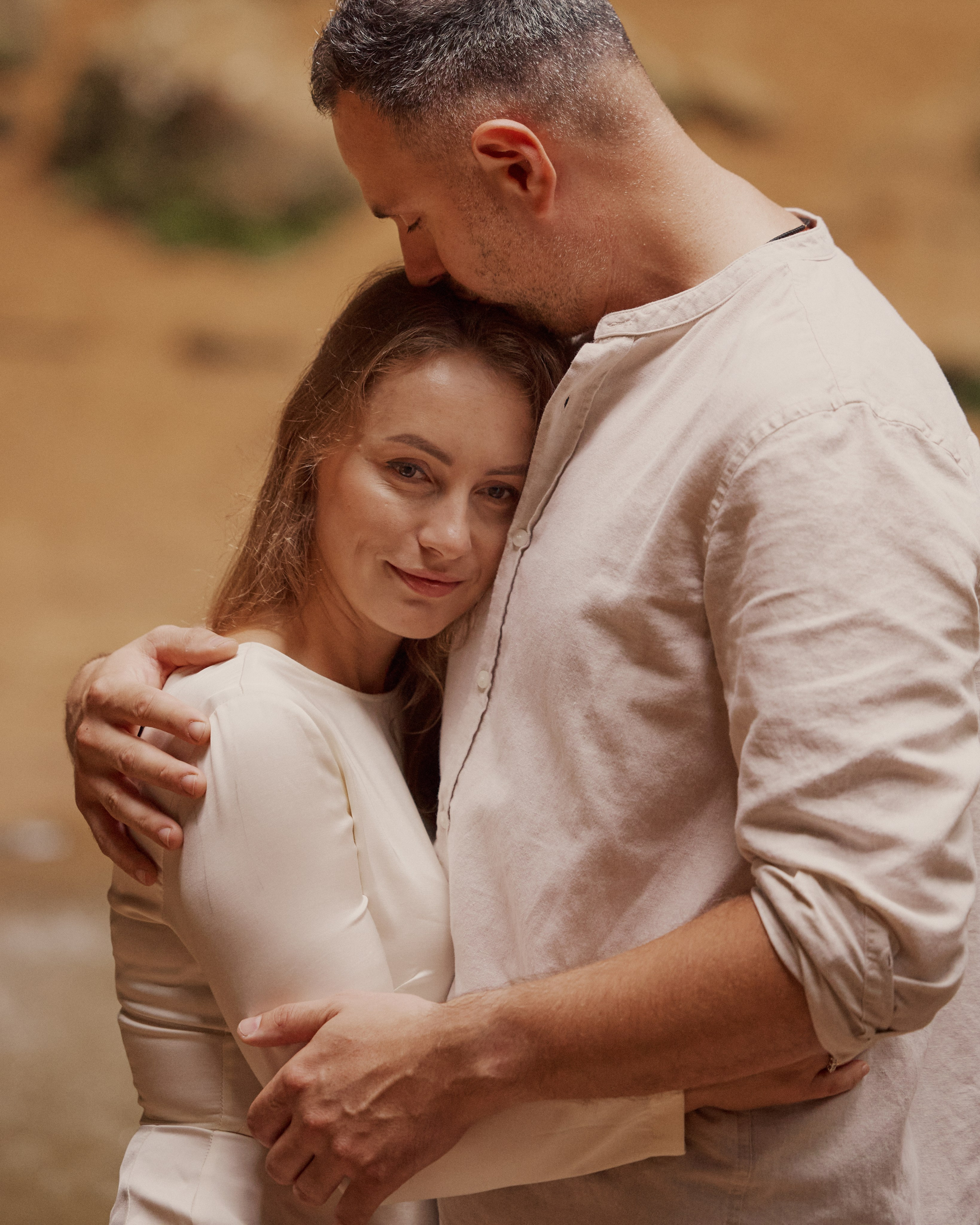 Tender embrace during an adventurous engagement shoot at Ash Cave, Hocking Hills Ohio