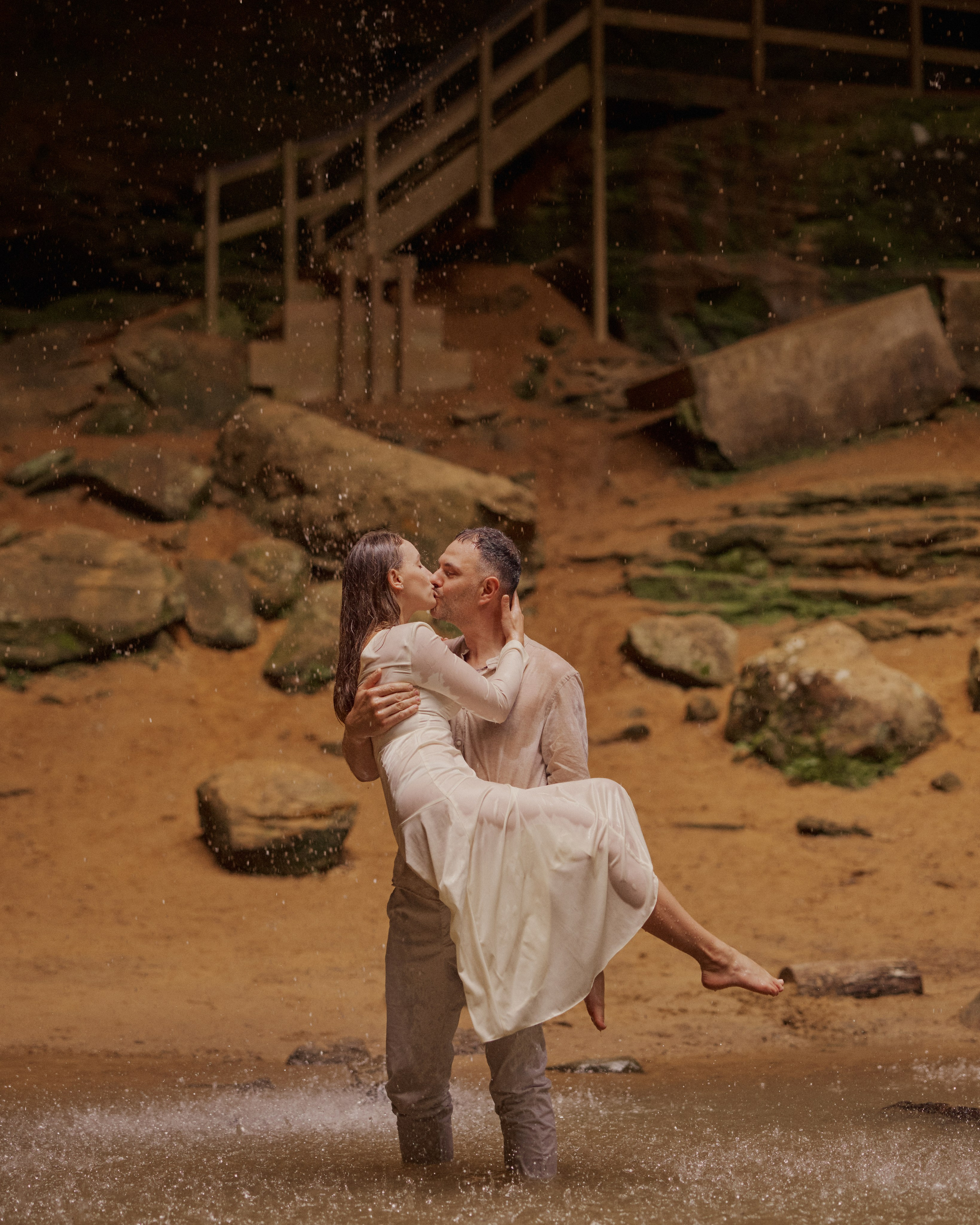 Carrying her through the stream near the cave stairs at Ash Cave, Ohio