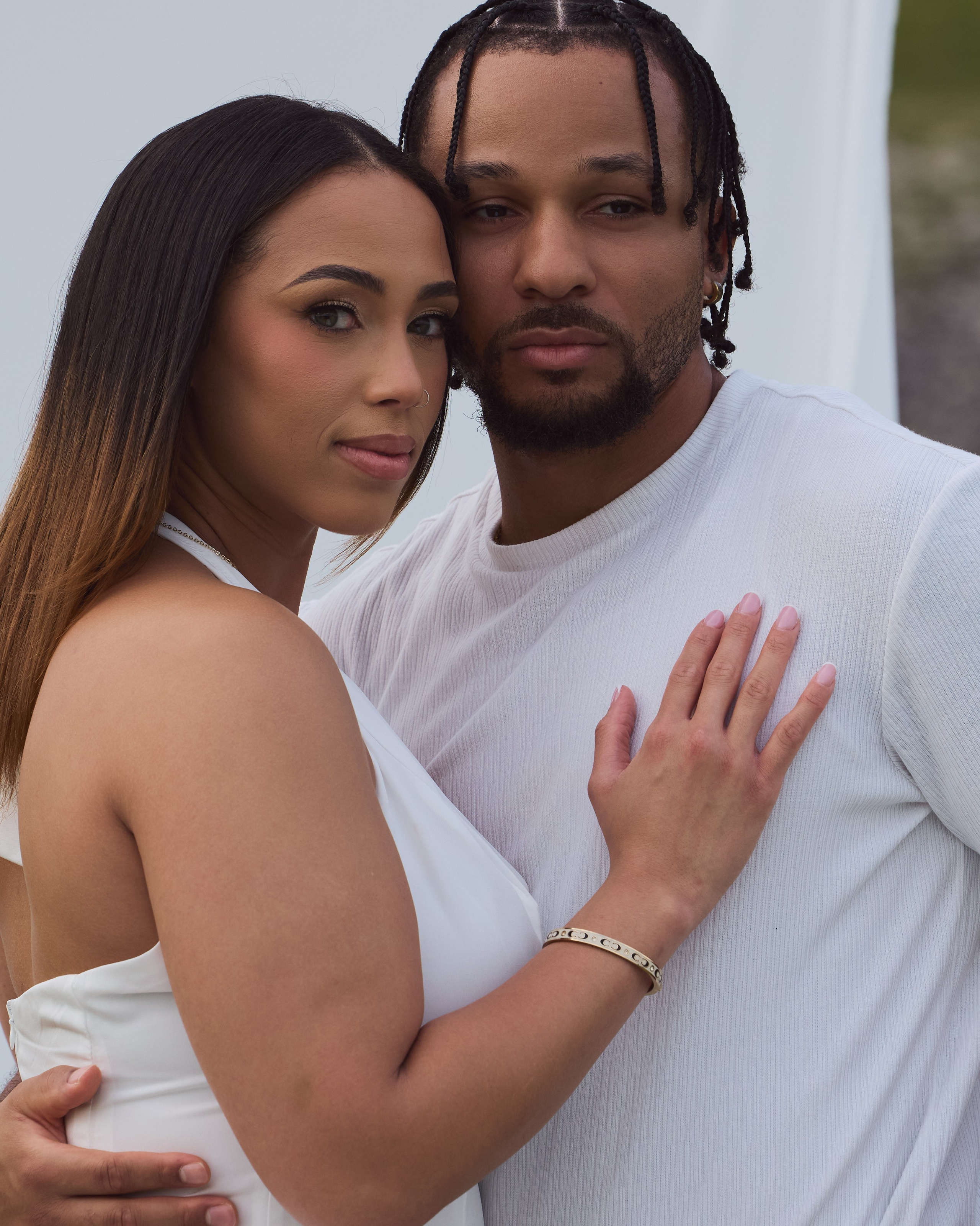 Close-up engagement portrait of a couple dressed in white at Alum Creek, Ohio