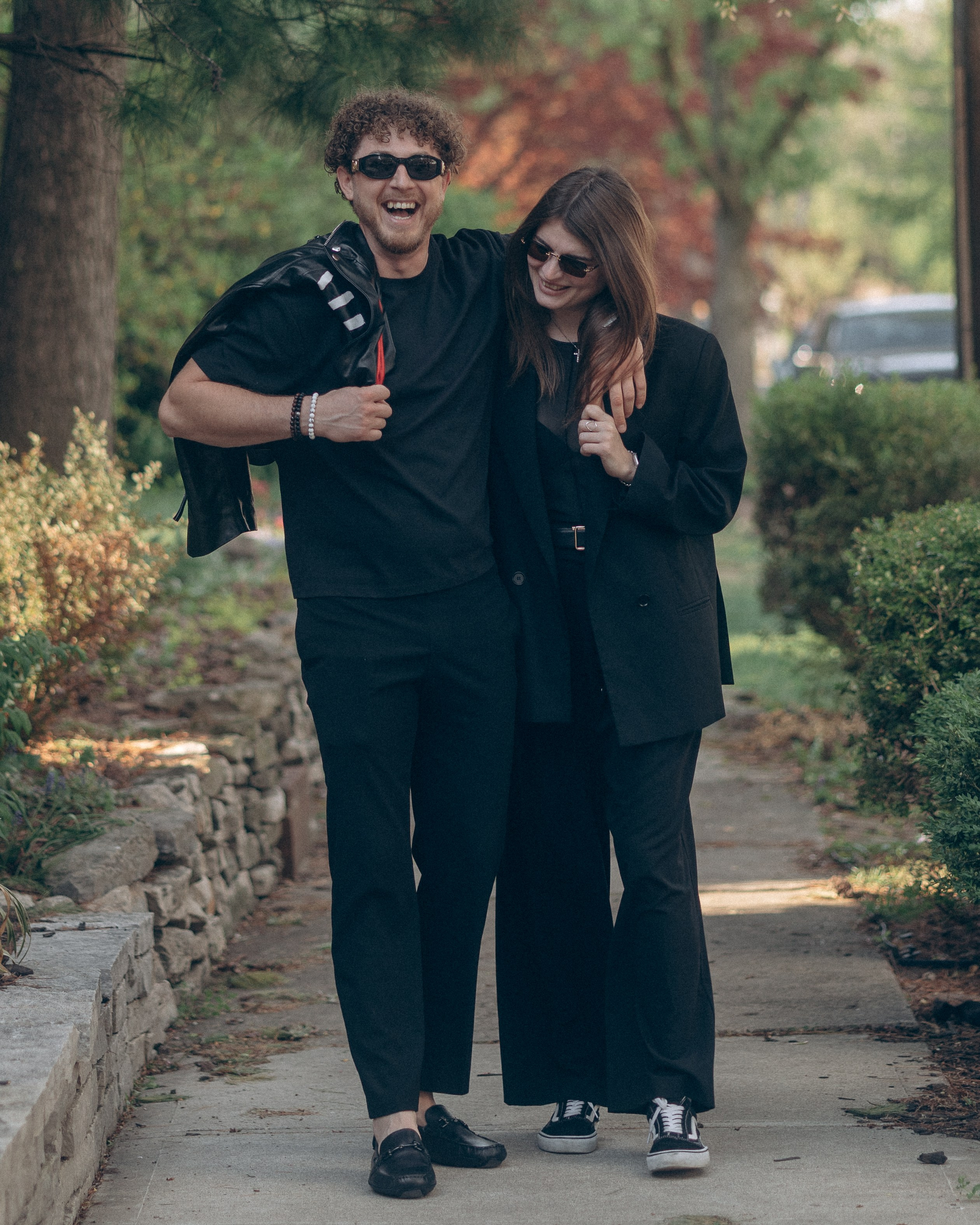 Strolling down a sidewalk in German Village during an edgy engagement shoot