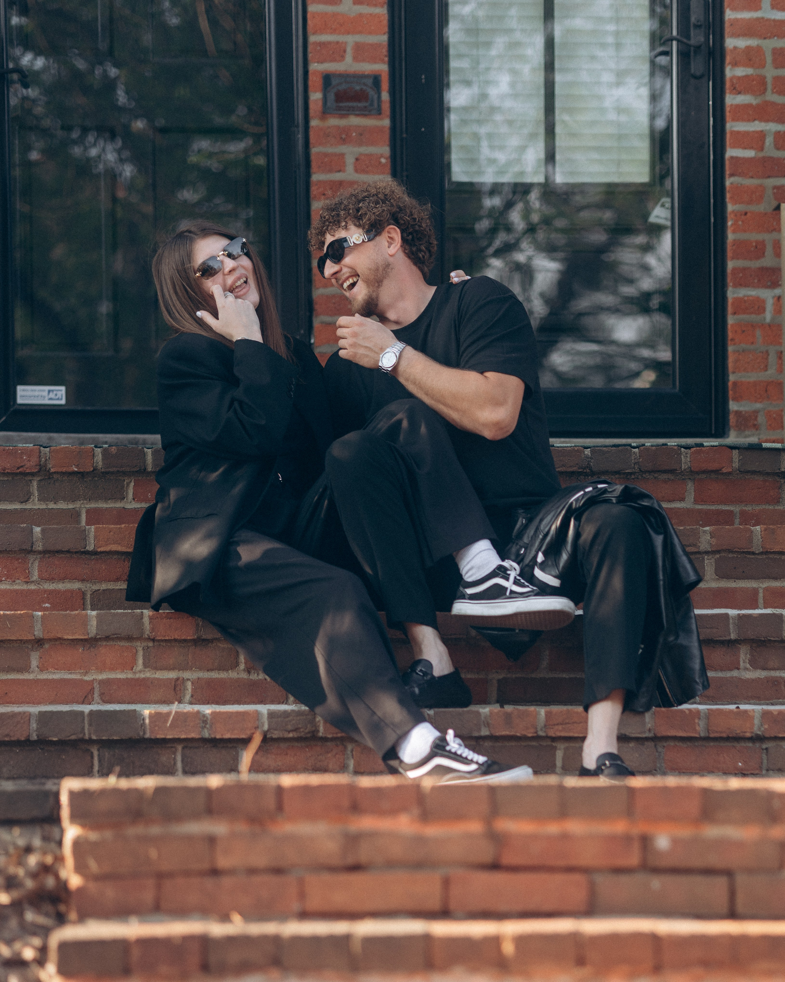 Laughing together on the steps of a brick house in German Village
